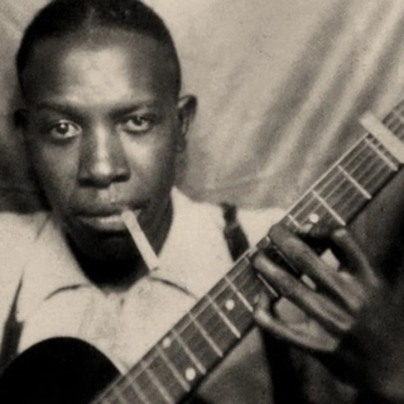Legendary bluesman Robert Johnson, who traded his soul in exchange for the ability to play the guitar like no other. The devil also threw in a pack of smokes.