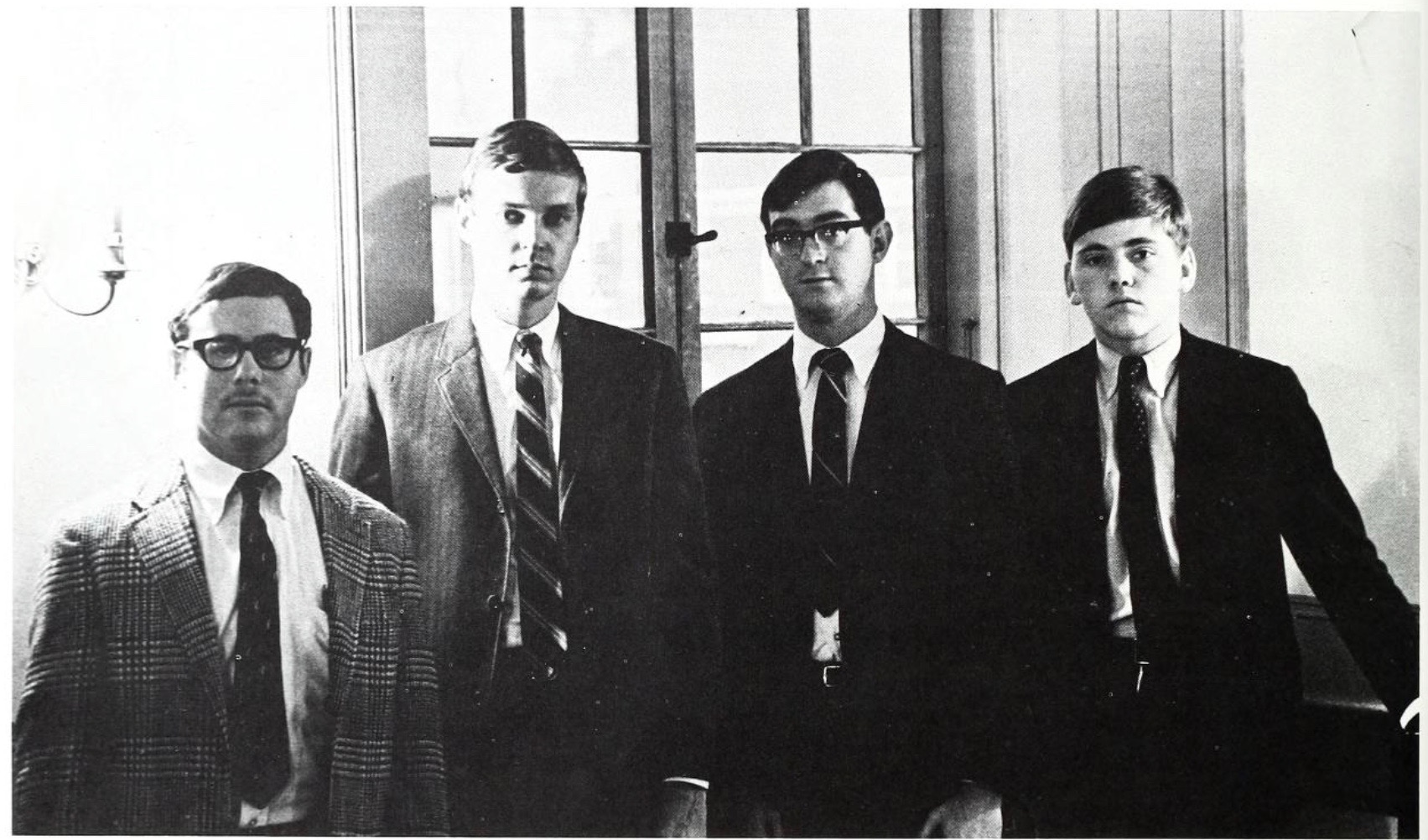 These fellas look innocent enough. But behind the cheery disposition, cheap suits and bad haircuts lurks a quartet of CIA operatives. The white socks gave them away.