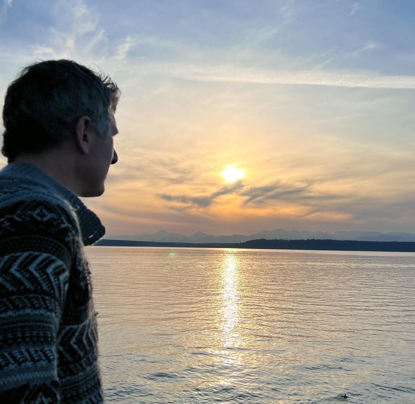 Dwayne forgot a jacket, so he borrowed a sweater from his mom. #sunset #gazingatpugetsound #edmondsmarina