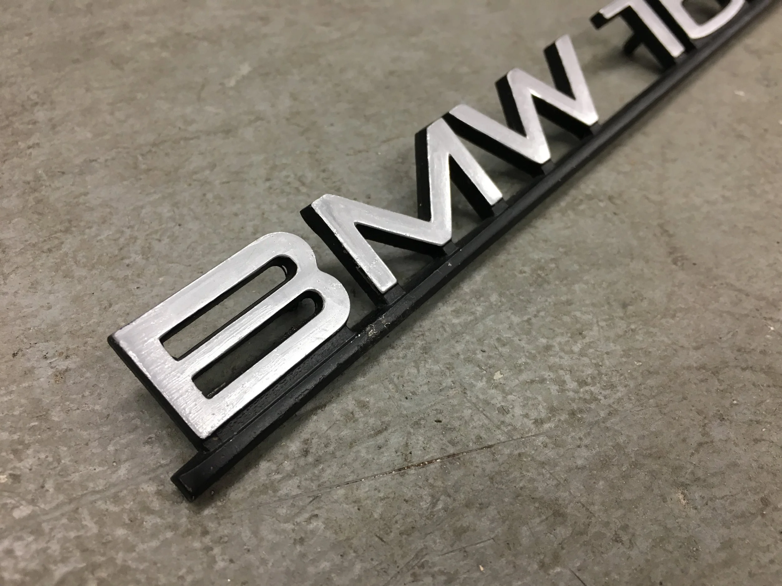 Early BMW 1600 Badge (spray painted)