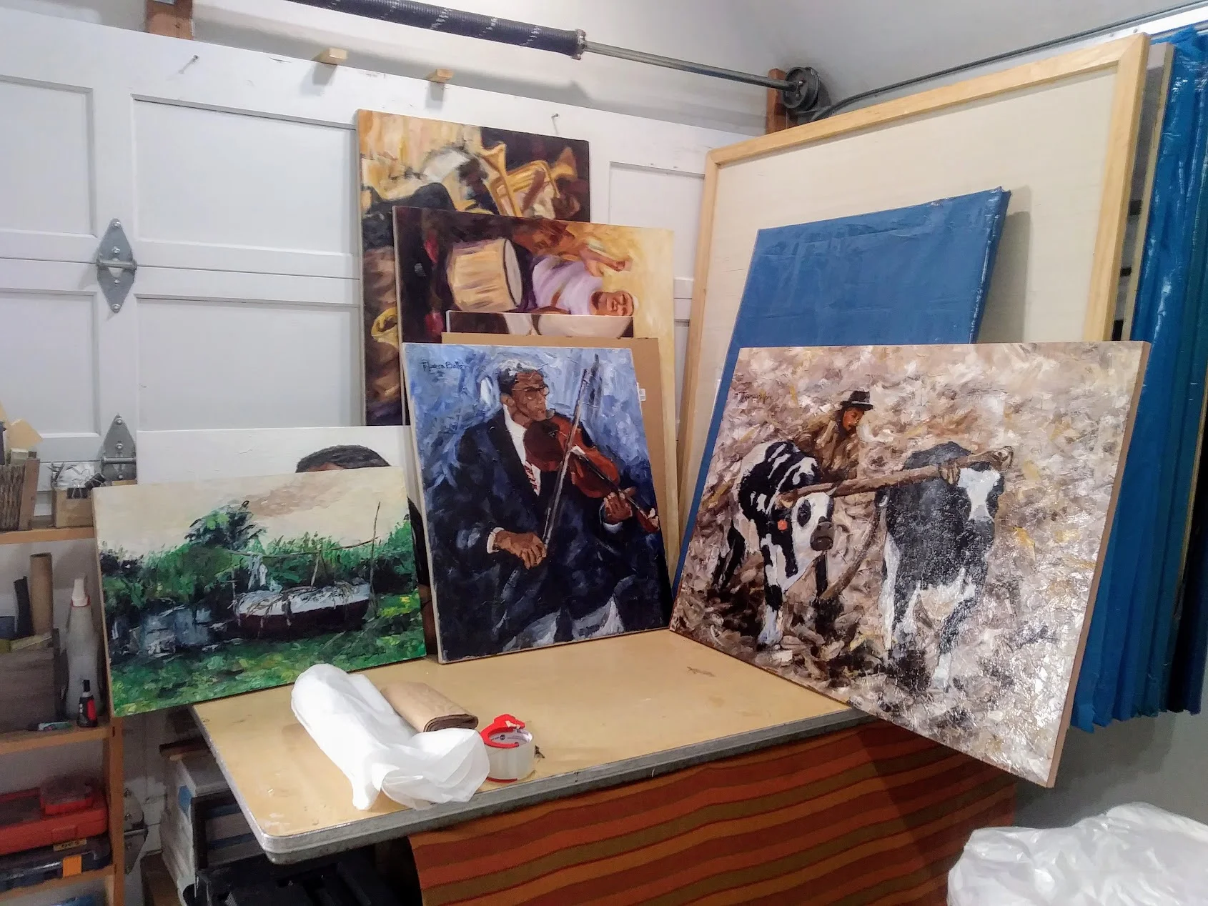 "Bote con Ramas Viejas" oil on wood panel 24"x16", "El Violinista" oil on canvas 23"x27", and "Arando el Campo" oil on wood panel 39"x27"