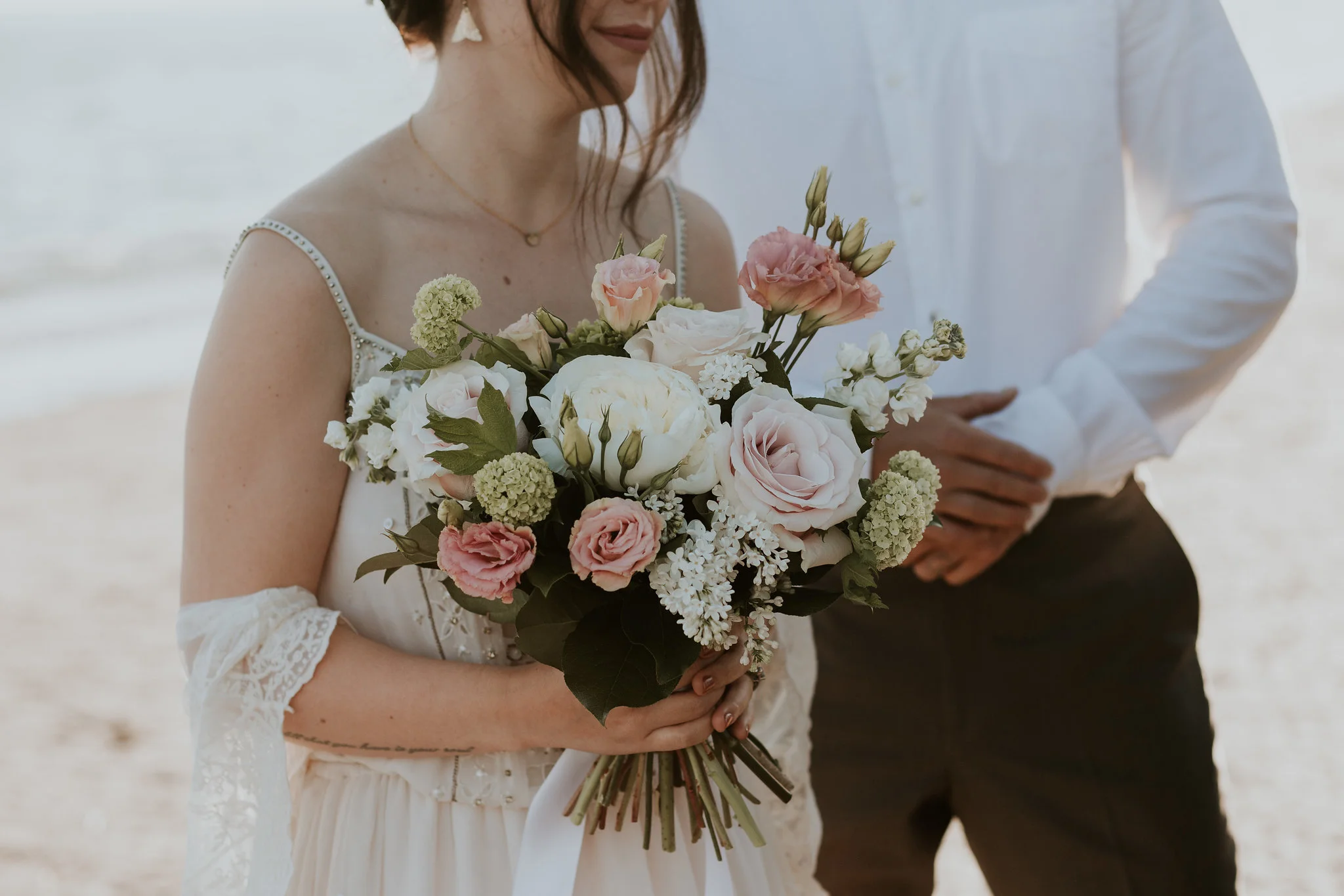 Keanna and Beau eloped at White Rock Beach. As the tide came in and their shoes came off, a playful water fight ensued. With the biggest smiles, this free spirited couple made their wedding day as natural and spontaneous as they are themselves.