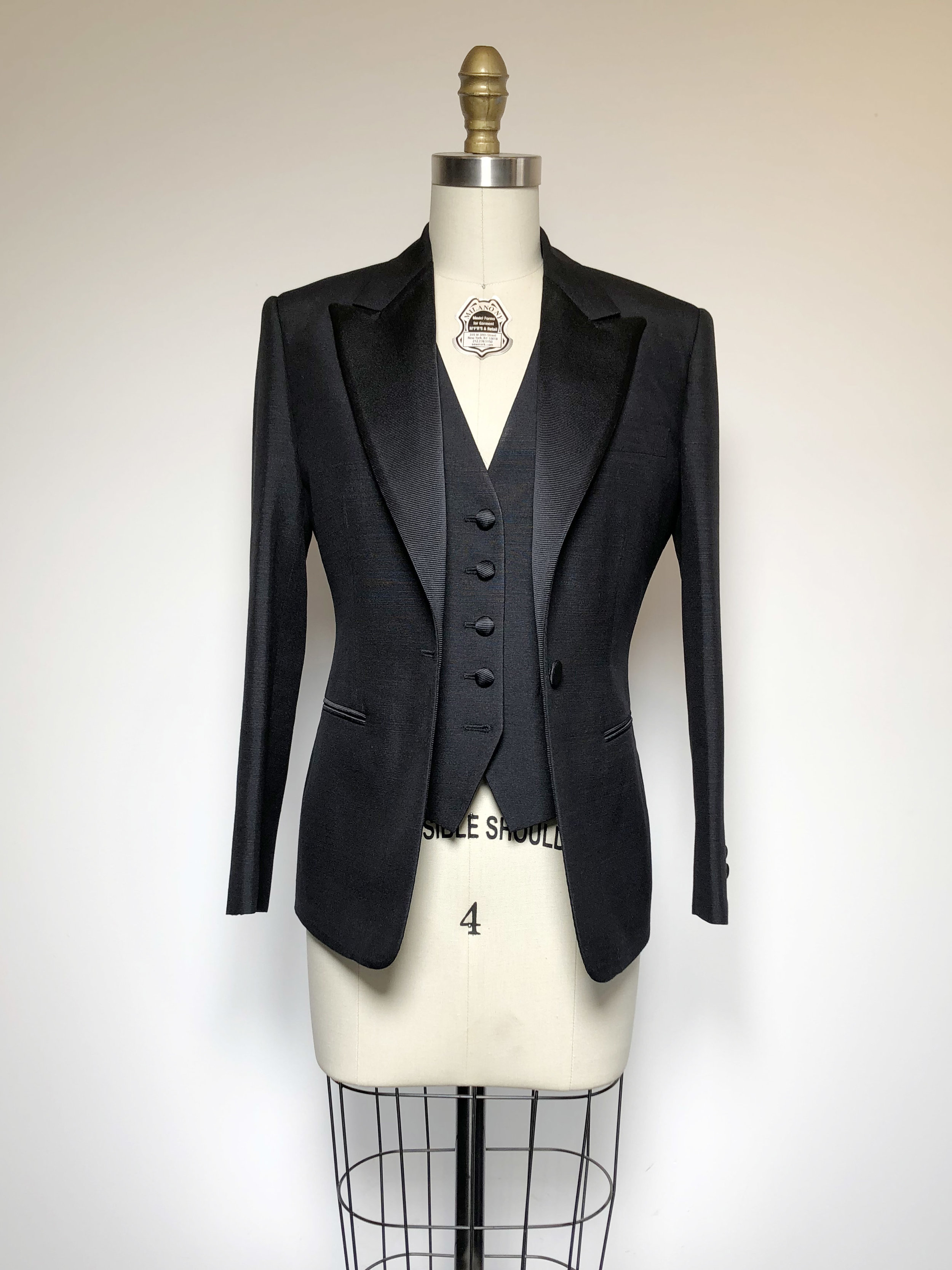 Bespoke ladies evening suit on tailors dummy