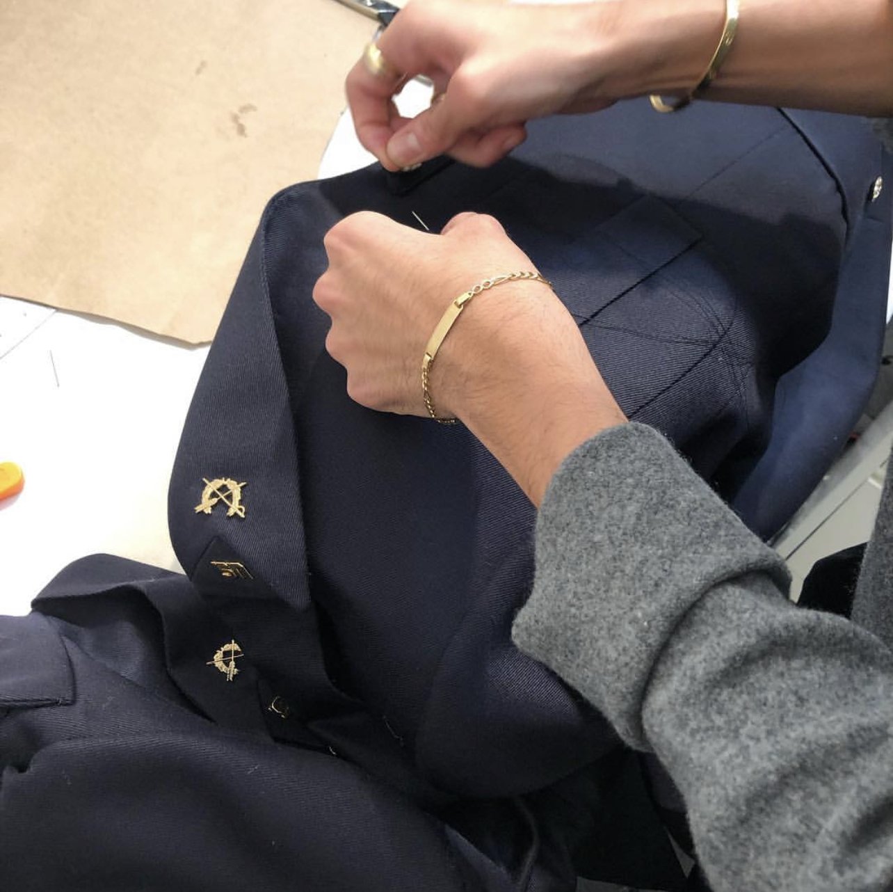 Working on a bespoke military jacket