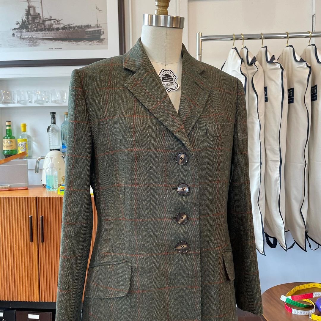 Beautiful ladies bespoke coat on tailors dummy