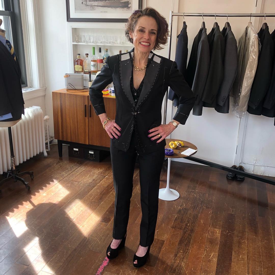 Very happy lady customer at a fitting! In bespoke suit