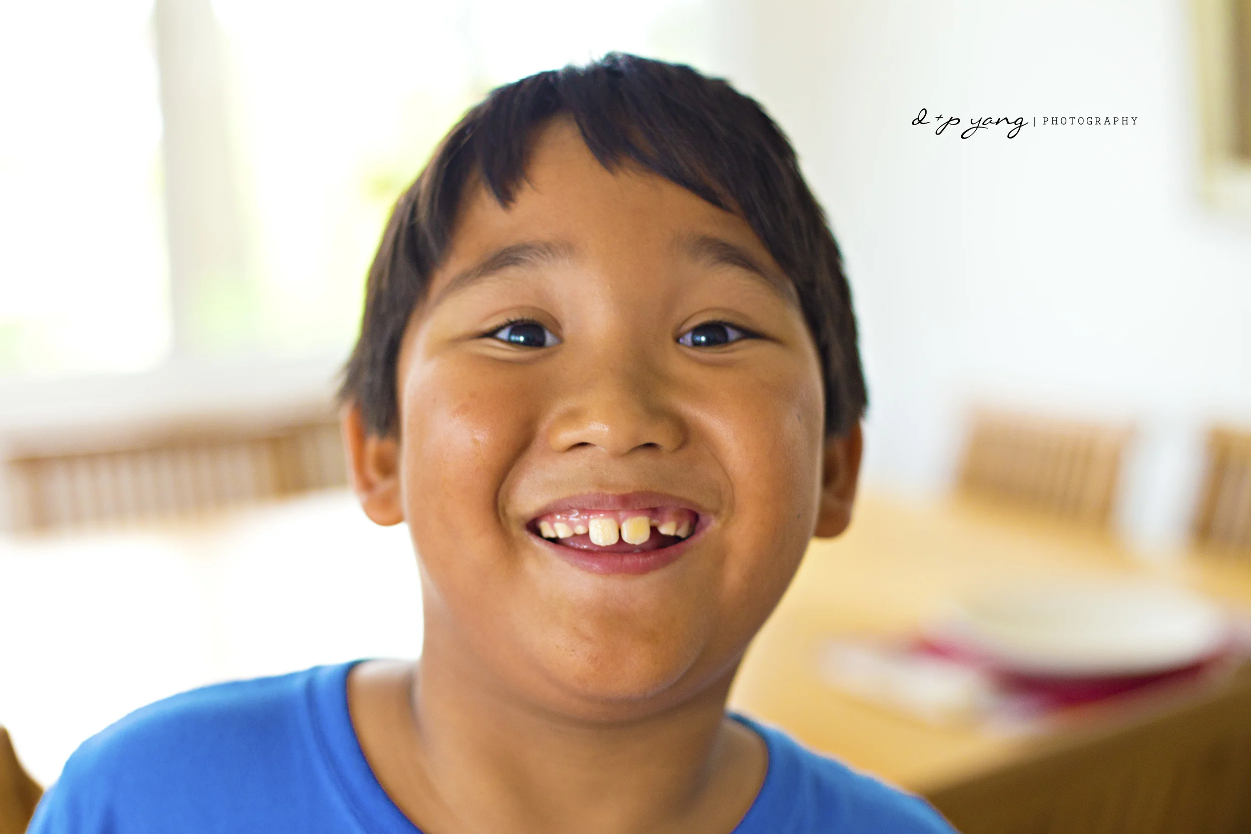 Joshua jumping in front of the camera as I was taking some snaps of their lovely home.