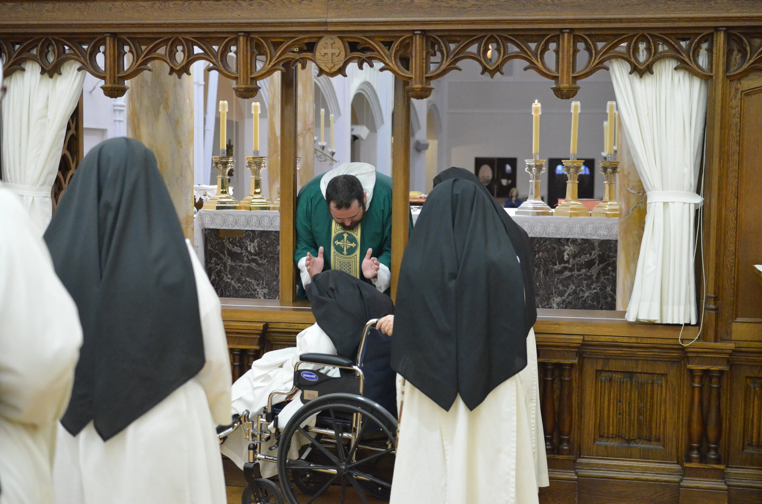 Fr. John blesses Sr. Mary Daniel, our eldest sister.