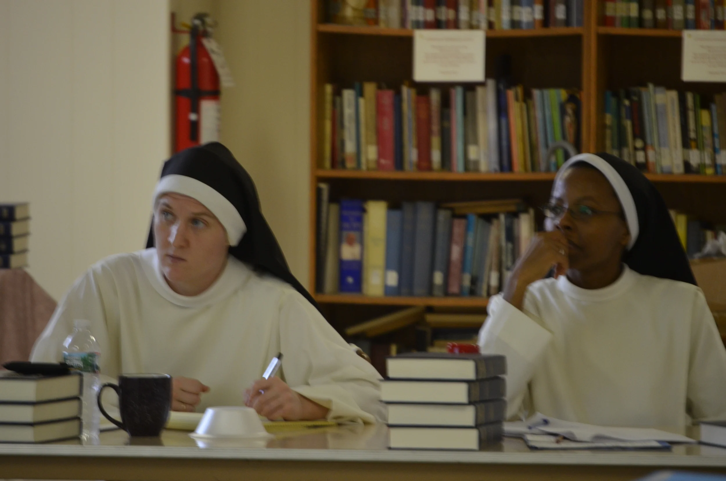 Sr. Mary Magdalene and Sr. Francisca listen intently during class.