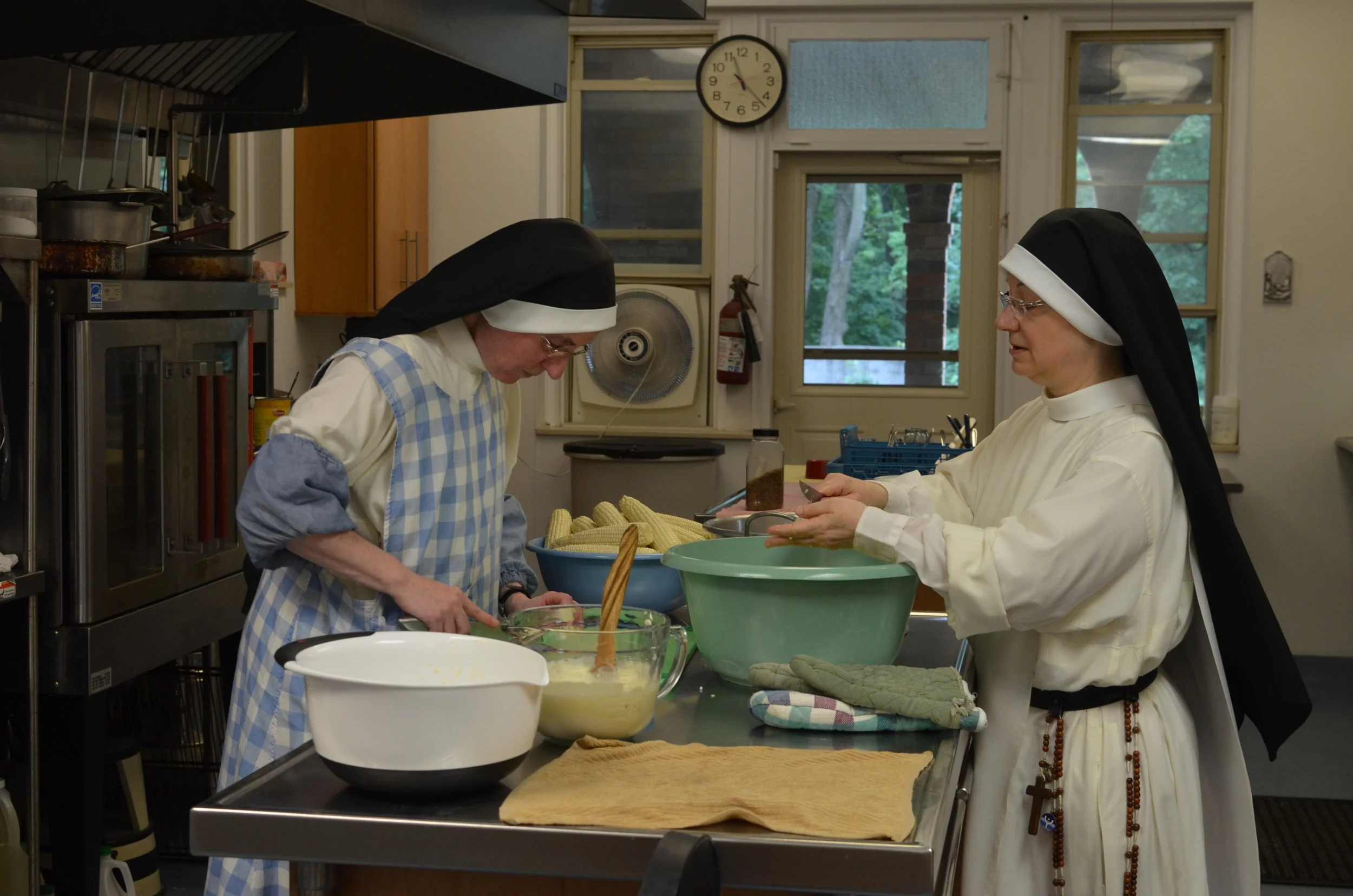 With Independence Day falling on a Saturday, Sr. Mary Martin was the lucky sister in charge of the grill. It had been awhile since sister grilled, but everything came out wonderfully. And there are always sisters who stop by the kitchen to lend a hand. Since it is a recreation day the sisters can chat as they work.