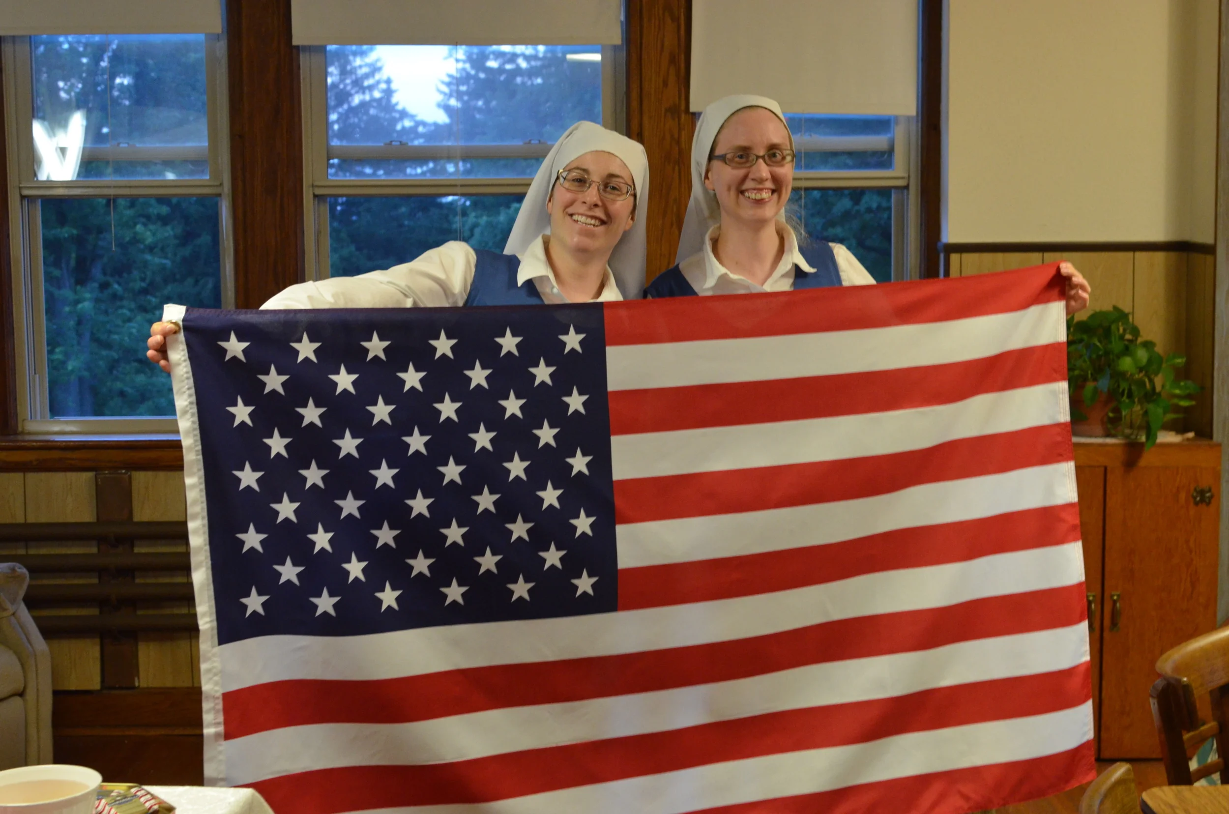 We always end evening recreation by singing the National Anthem. Sr. Danielle and Sr. Maria were appointed to be the official flag holders. 