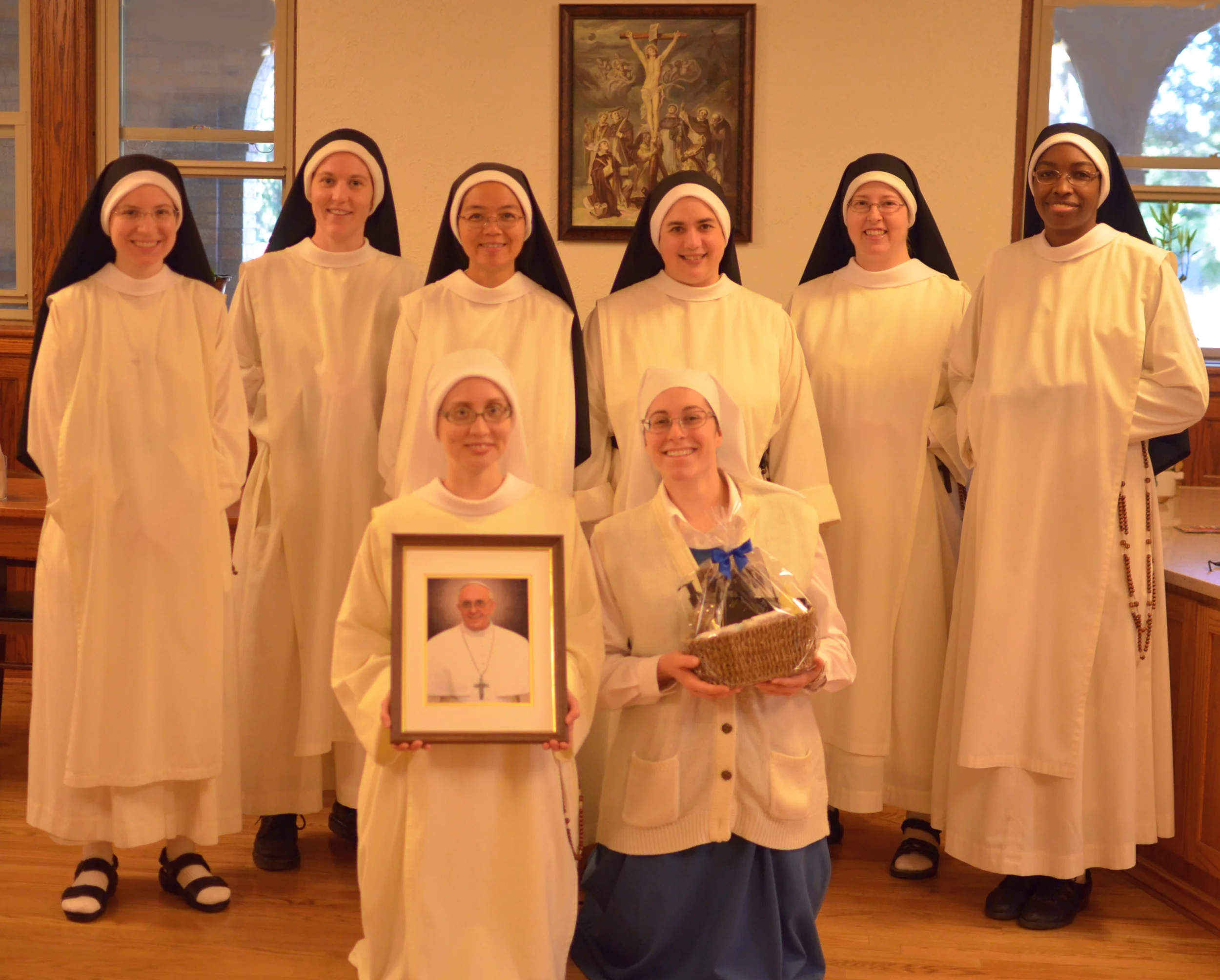 The sisters who work in the soap department pose with our picture of Pope Francis and his soap.