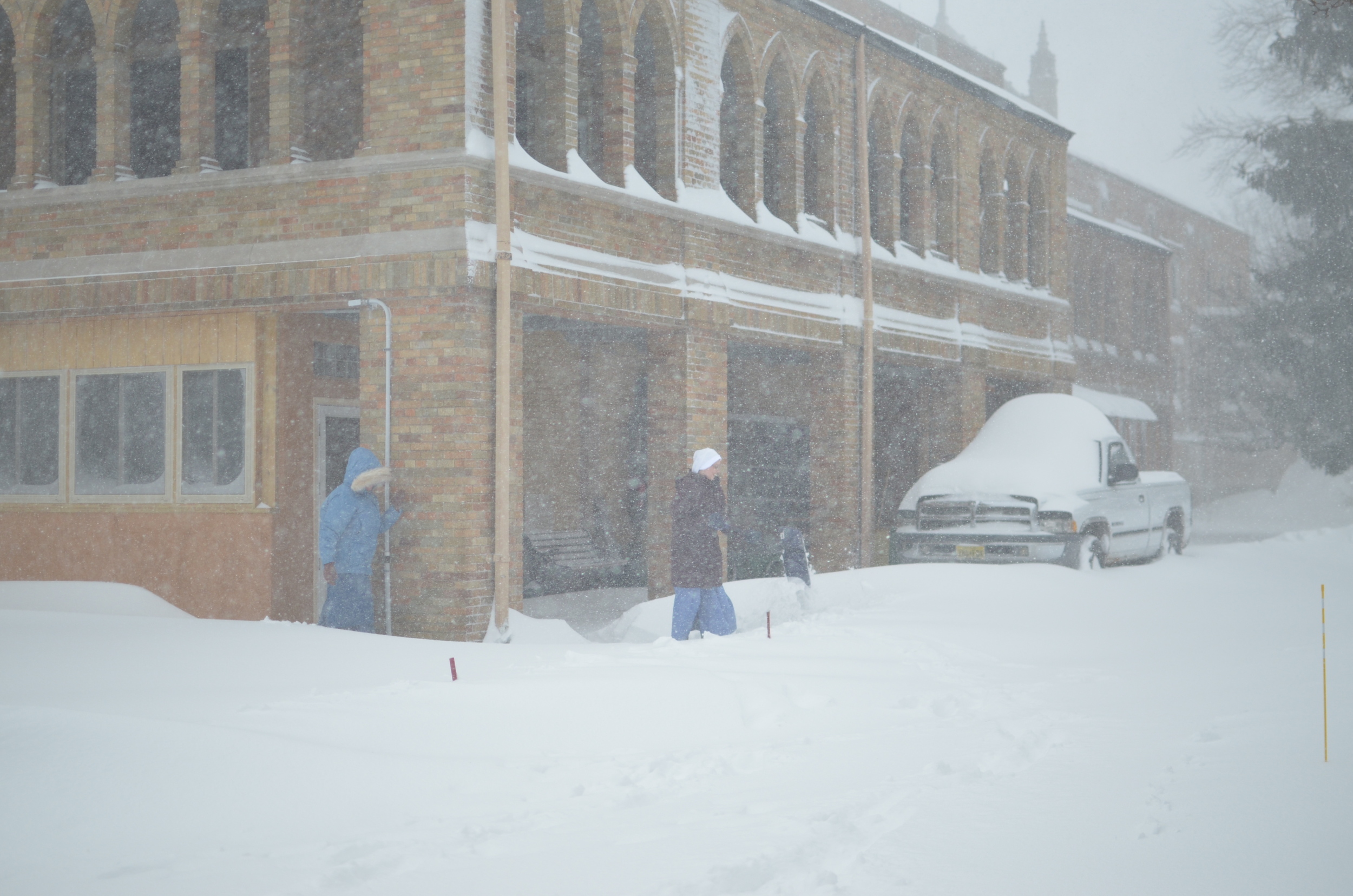 Shoveling out a path through the drifts.
