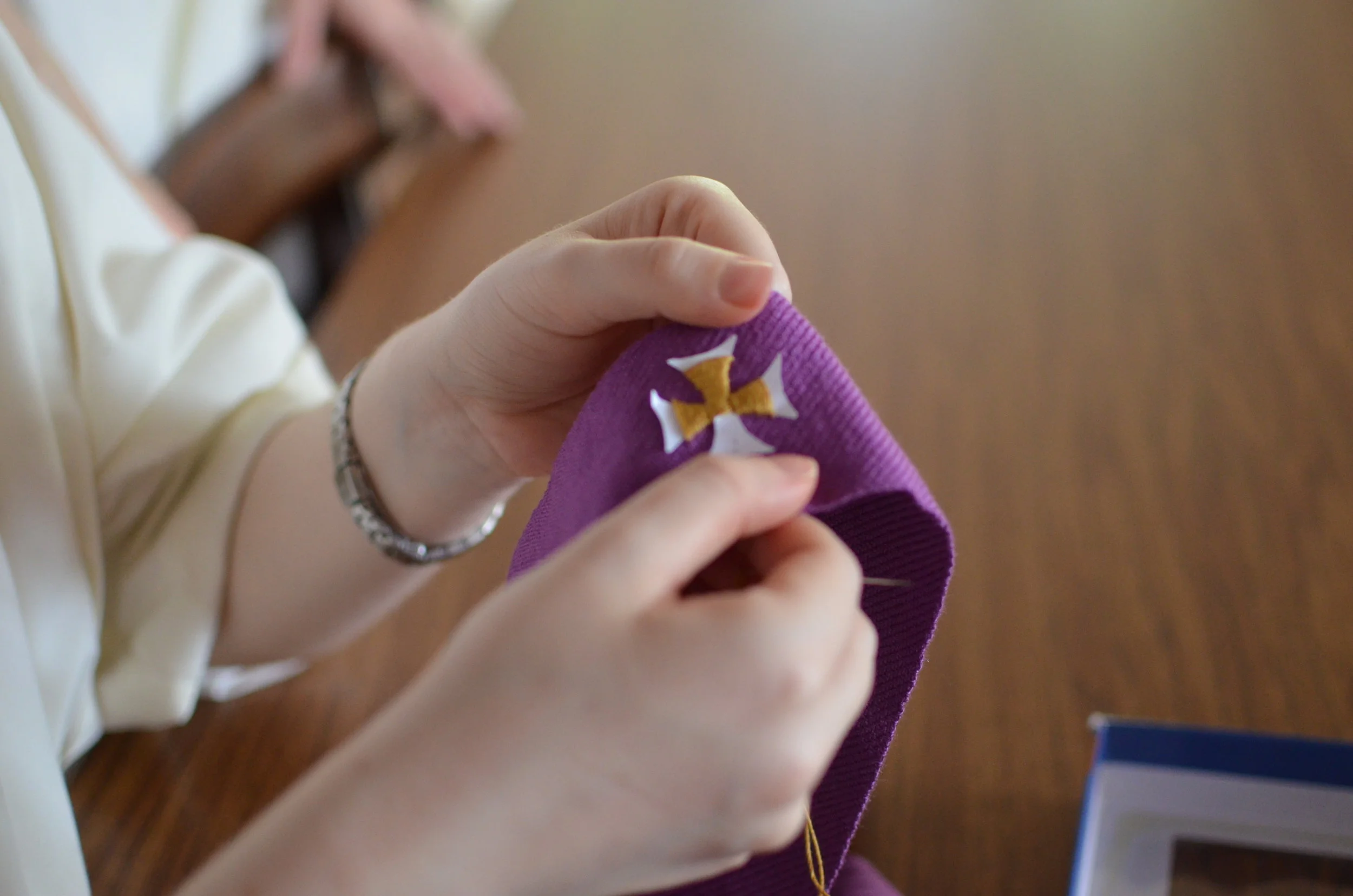 7) The last part is embroidering on at least the middle cross. Here Sr. Mary Veronica is embroidering on the cross.