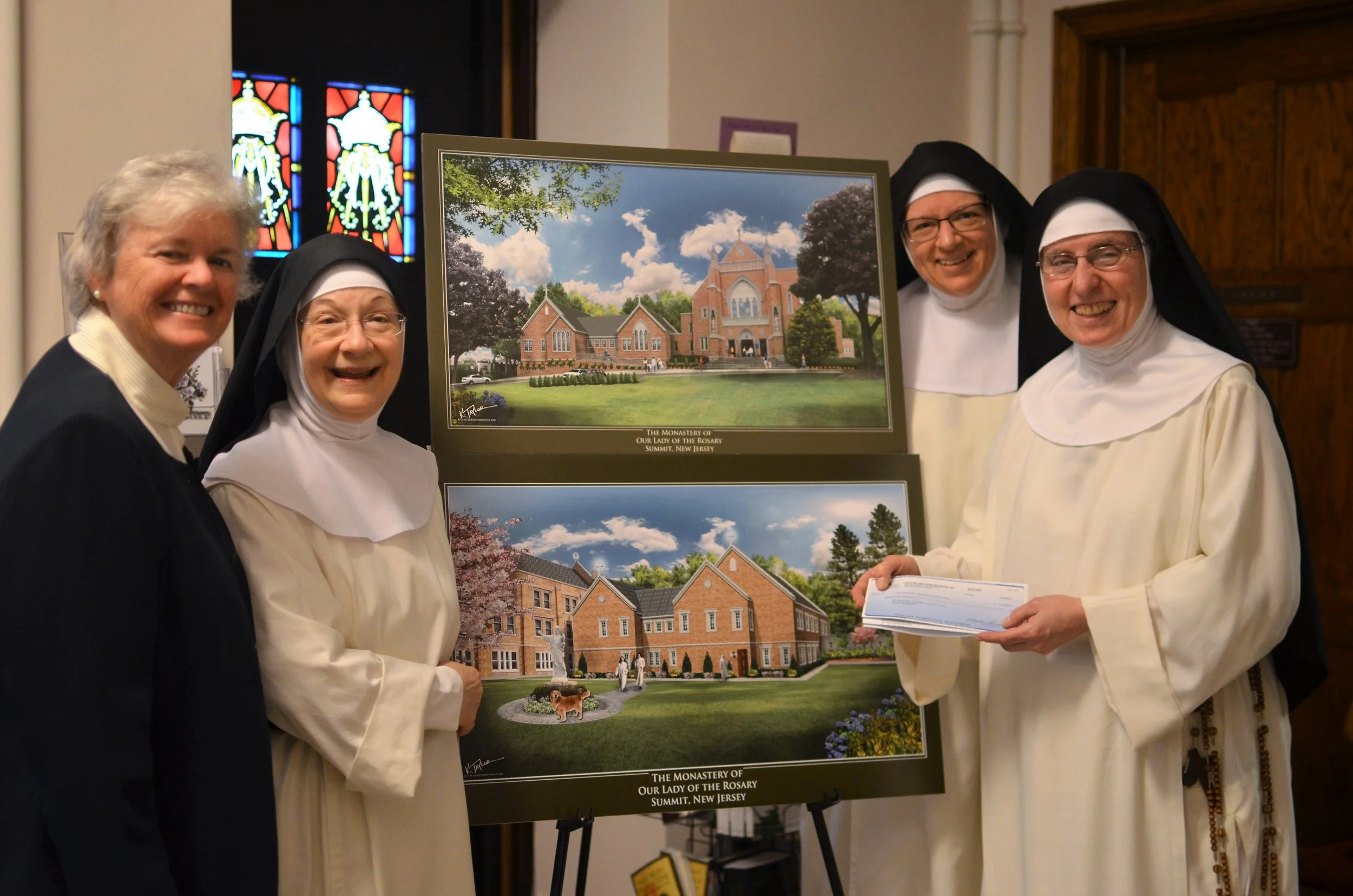 Sr. Patricia Codey, SC, Board Member of Support Our Aging Religious , presented the community with a $15K grant check for our new wing's handicap ramp.