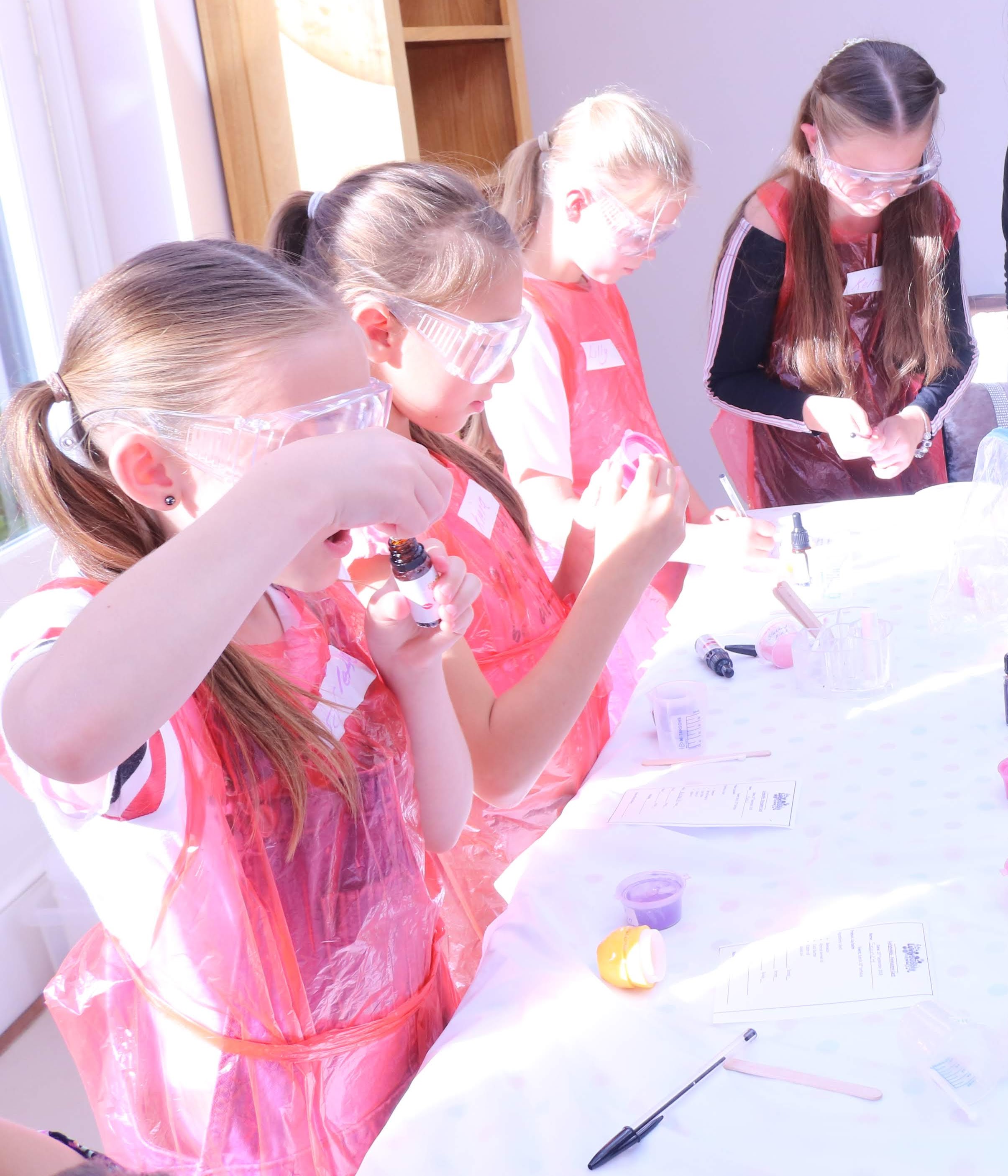 girls making lip balm.JPG