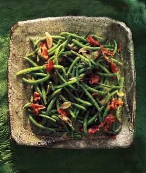 Ingredients kosher salt and black pepper 2 pounds green beans, trimmed 6 slices bacon (preferably Nitrate-free) 2 shallots, sliced 2tablespoons cider vinegar (Bragg's brand preferred) 2tablespoons whole-grain mustard 2tablespoons olive oil (First Cold-pressed, Extra Virgin) Directions Bring a large pot of water to a boil and add 1 tablespoon salt. Add the green beans and cook until just tender, 4 to 5 minutes. Drain and run under cold water to cool; transfer to a serving bowl. Meanwhile, in a medium skillet, cook the bacon over medium heat until crisp, 6 to 8 minutes; transfer to a paper towel-lined plate. Let cool, then break into pieces. (can cook bacon on an aluminum lined cookie sheet in a 400 degree oven until done) Discard all but 2 tablespoons of the bacon drippings from the skillet and return to medium heat. Add the shallots and cook, stirring, for 1 minute. Stir in the vinegar, mustard, oil, ¾ teaspoon salt, and ¼ teaspoon pepper. Add to the green beans, along with the bacon, and toss to combine. Adapted recipe By Kate Merker and Sara Quessenberry , Real Simple, October 2010