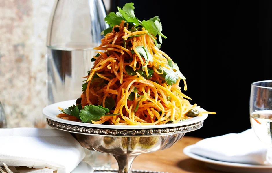 Carrot Salad with Coriander Vinaigrette and Pistachios bon appe´tit, PUBLISHED: MAY 2014 Carrot Salad With Coriander Vinaigrette And Pistachios Using your food processor’s shredding blade makes this simple bistro salad a very doable weeknight option. SERVINGS: 4 Ingredients ¼ cup unsalted, shelled raw pistachios ¾ teaspoon coriander seeds ½ garlic clove, finely grated 3 tablespoons fresh lemon juice ¼ teaspoon crushed red pepper flakes ⅓ cup olive oil Kosher salt 1 pound carrots, peeled, julienned or coarsely grated 1 cup fresh cilantro leaves with tender stems Recipe Tips Preparation Do Ahead: Preheat oven to 350°. Toast pistachios on a rimmed baking sheet, tossing occasionally, until golden brown, 6–8 minutes. Let cool; coarsely chop. Toast coriander in a small dry skillet over medium heat, tossing often, until fragrant, about 1 minute. Let cool; coarsely chop. Whisk garlic, lemon juice, red pepper flakes, and coriander in a large bowl, then whisk in oil; season with salt. Add carrots, toss, and let sit at least 30 minutes. Toss with cilantro and pistachios just before serving. DO AHEAD: Salad (without cilantro and nuts) can be made 1 day ahead. Cover; chill.
