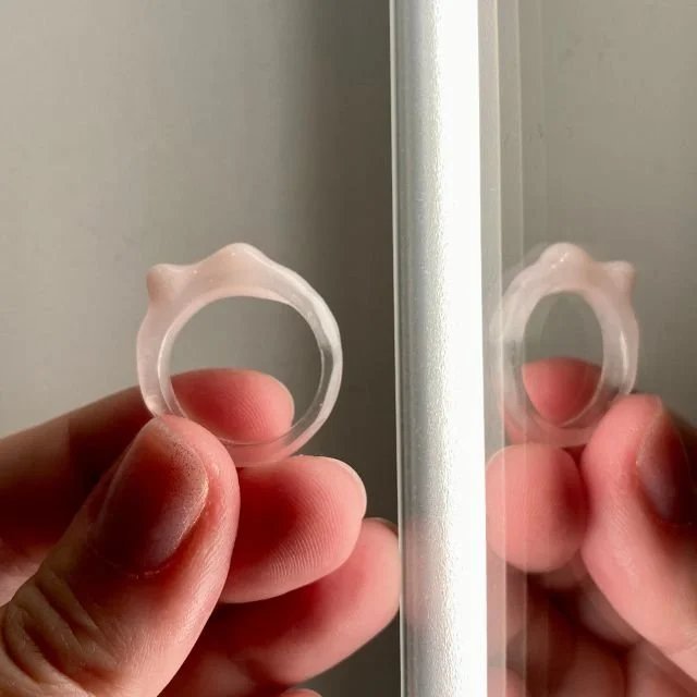 Transparent and soft pink acrylic ring from the Uneven collection with an organic sculptural form