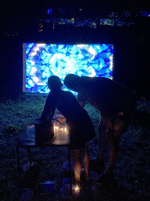 people in front of kaleidoscope installation at a festival