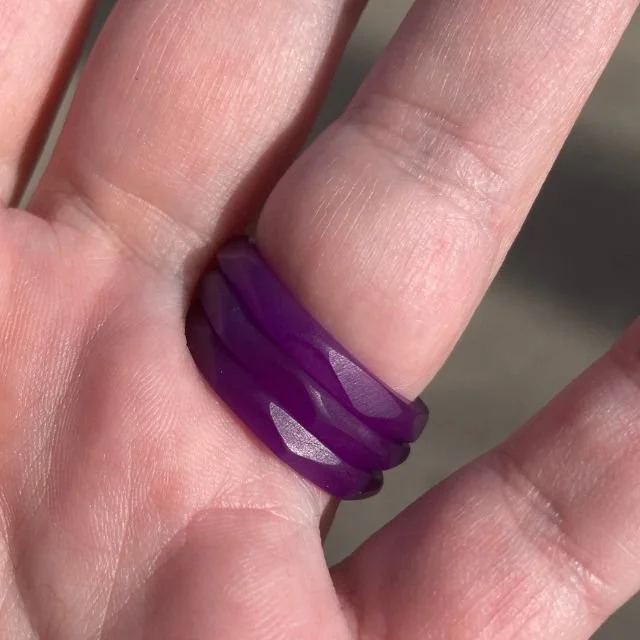 Violet plexiglass rings from the Uneven collection — hand-crafted, upcycled jewelry with a contemporary sculptural aesthetic.
