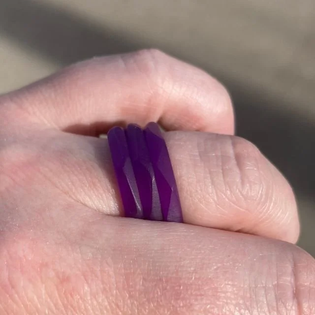 Violet plexiglass rings from the Uneven collection — hand-crafted, upcycled jewelry with a contemporary sculptural aesthetic.