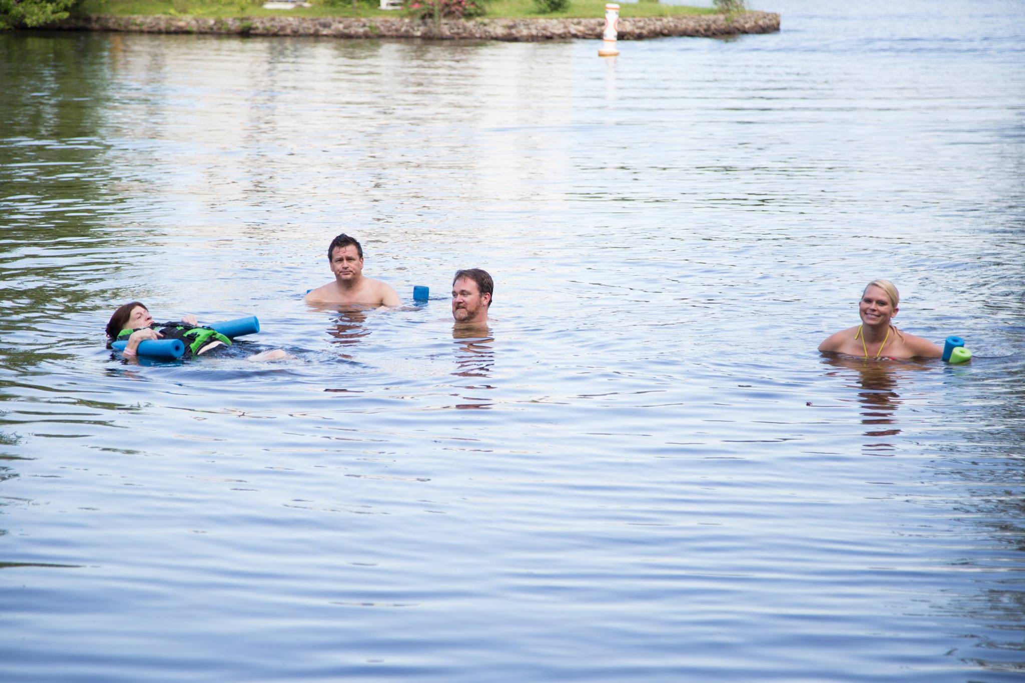 Carolyn, her two baby boys, and her sweet daughter-in-love, Crystal floating around Cedar Lake, summer 2015