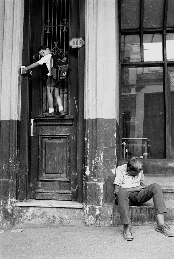 Boy on Door Ringing Doorbell, Havana, Cuba, 2000 Archival Inkjet Print, 20” x 13 ⅜” Edition of 15