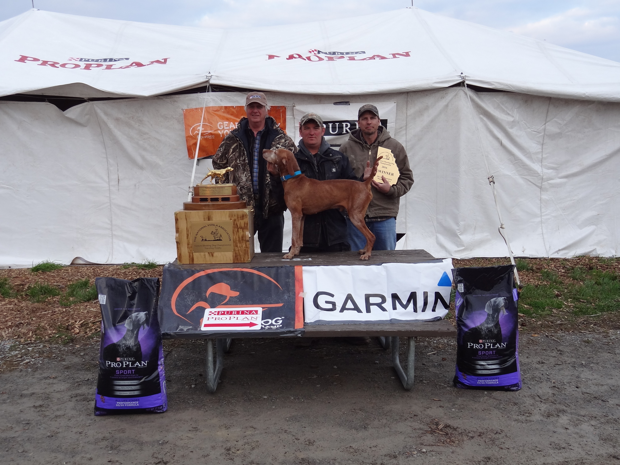 Pictured from Left to Right: Mark Johnson, Dan Diambro(handler) with Shiloh’s Red White & Blue (Winner) and Rob Tomzcak (owner)