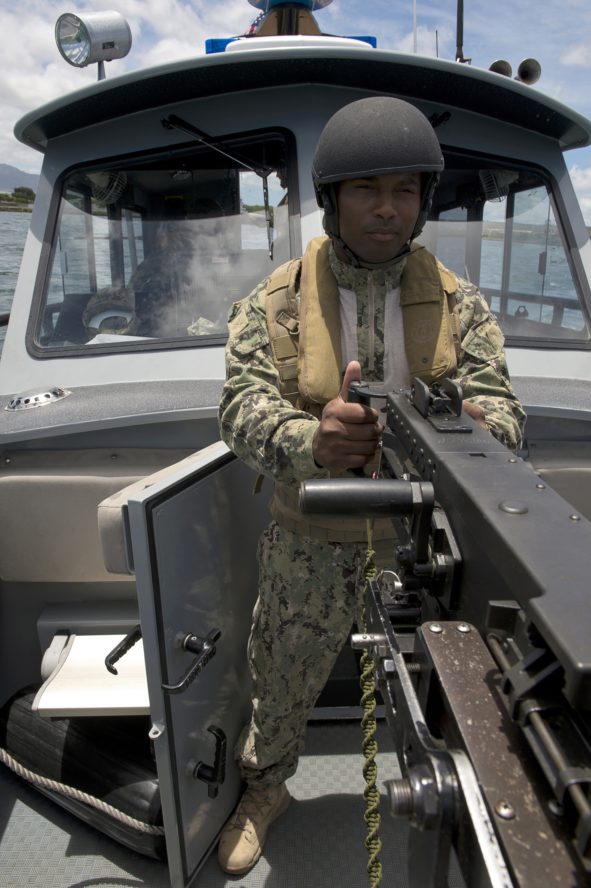 Manning the .50 caliber machine gun