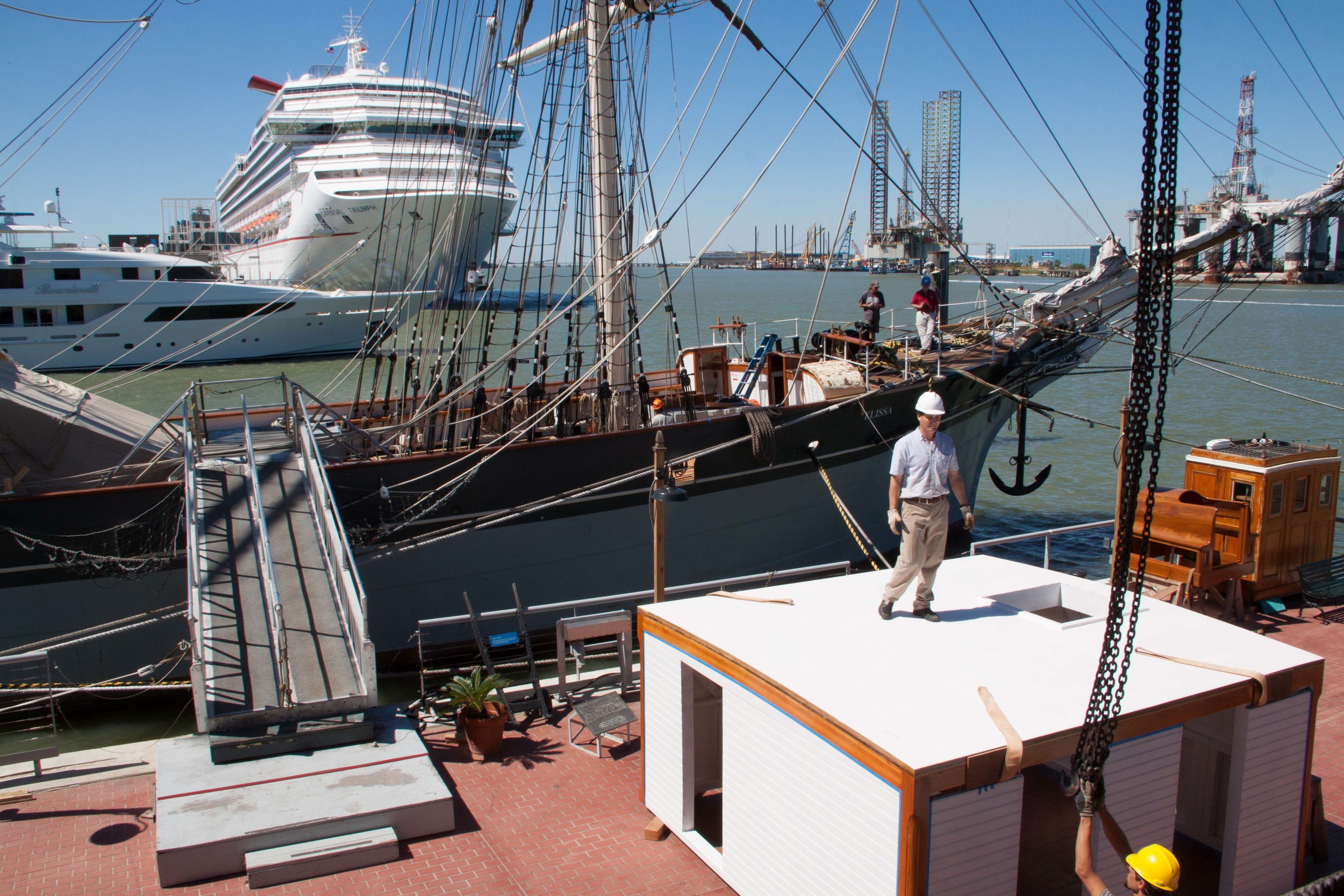 Moving the new deckhouse onto the nearly finished deck.