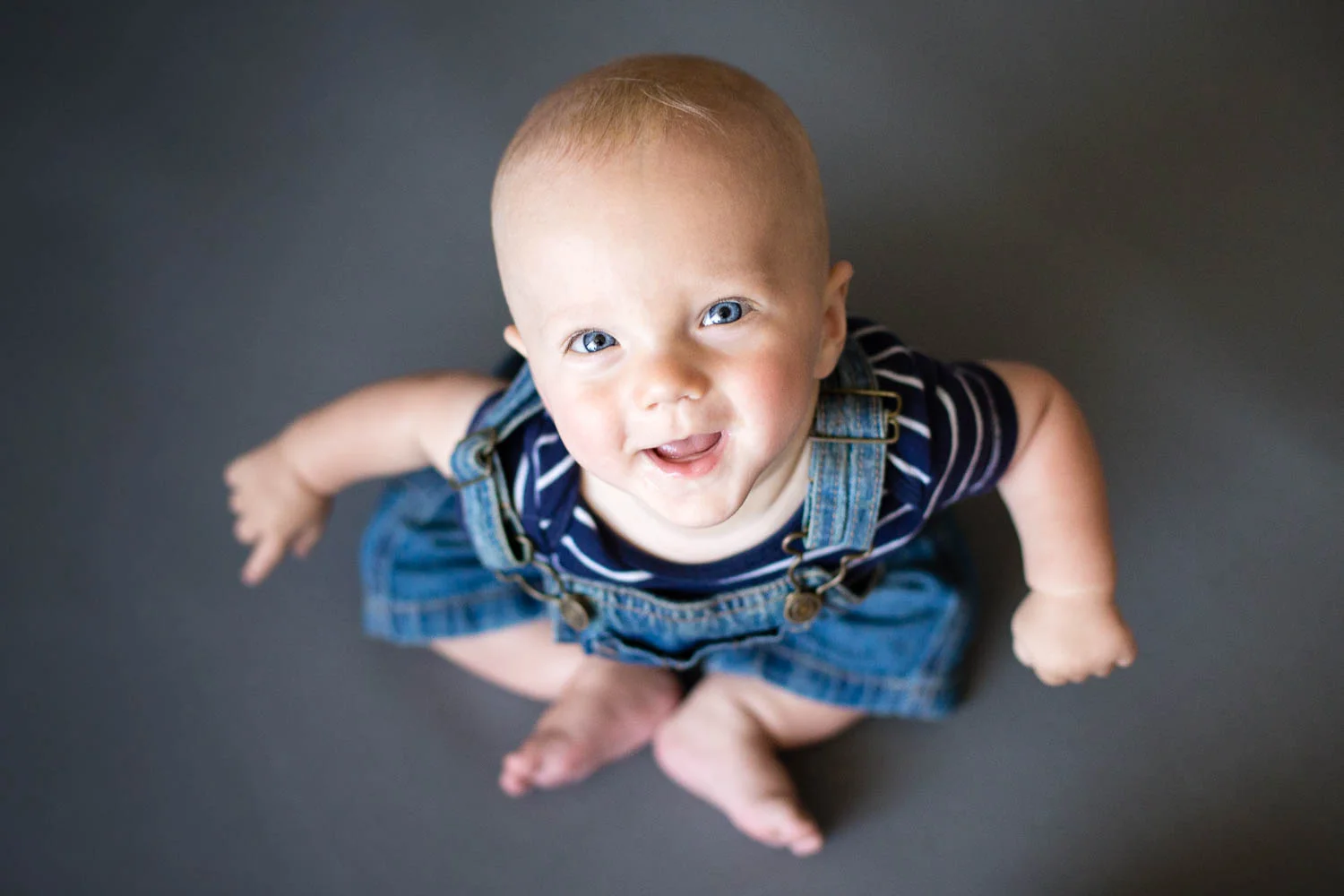 Portrait of a baby boy looking up into camera