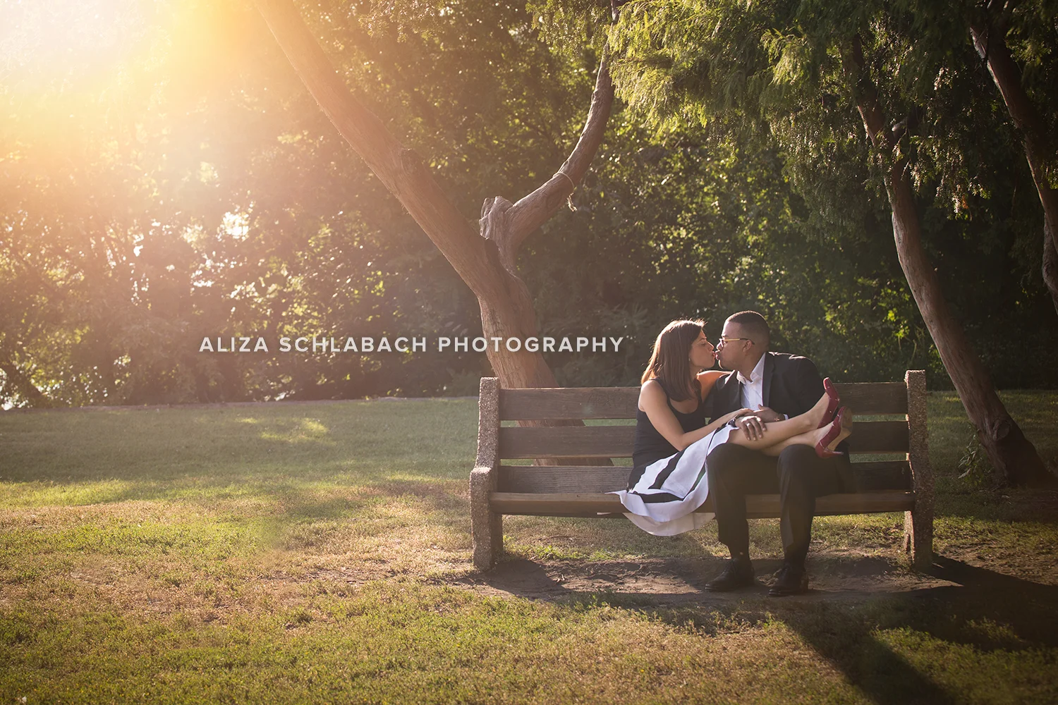 Golden hour portrait of a couple on a bench