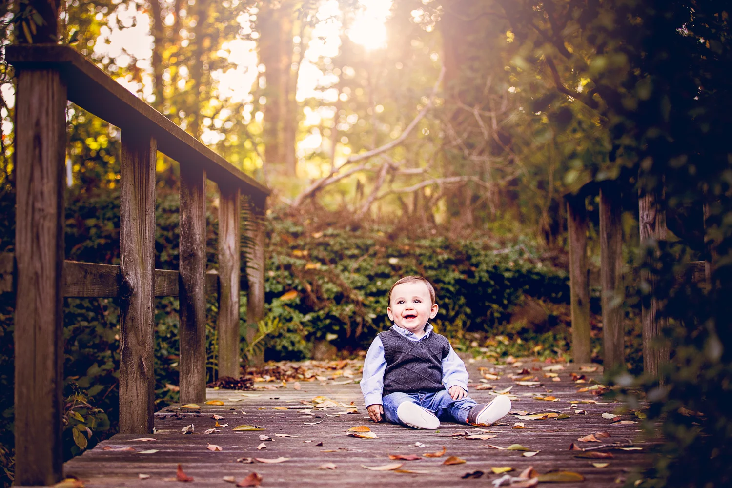 Portrait of a baby sitting on the bridge at Appleford Estate in Villanova