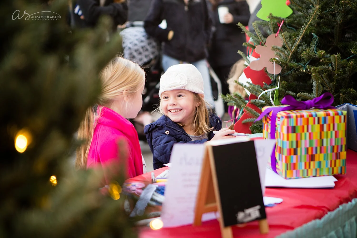 Event photo of little girls crafting and smiling at the Cricket Cringle in Ardmore, PA - 2015