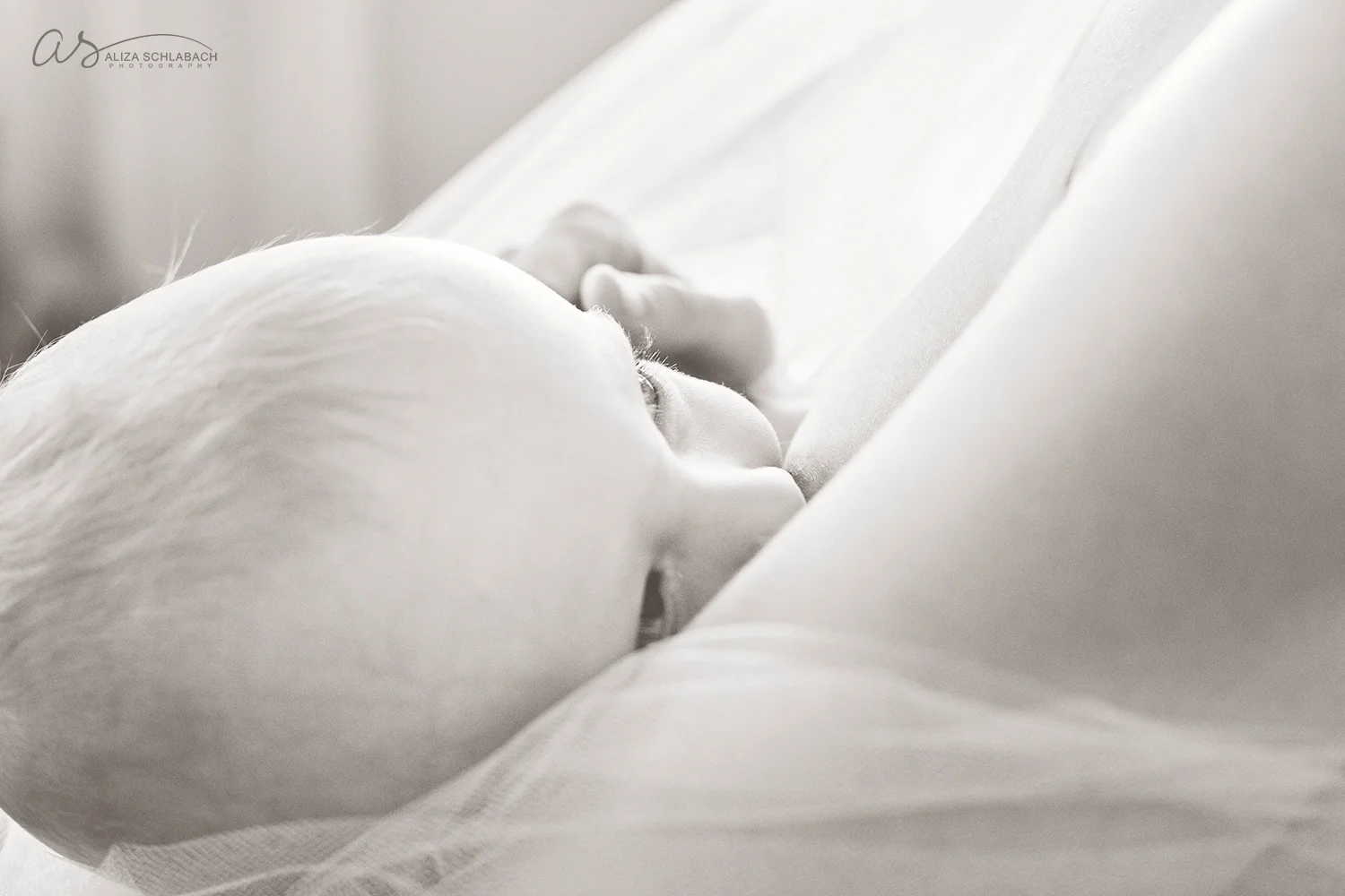 Black and white photo of a nursing baby