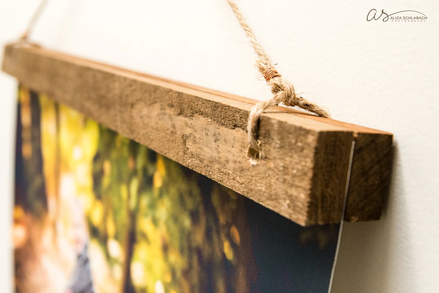 Detail of canvas mounted between pieces of reclaimed barnwood