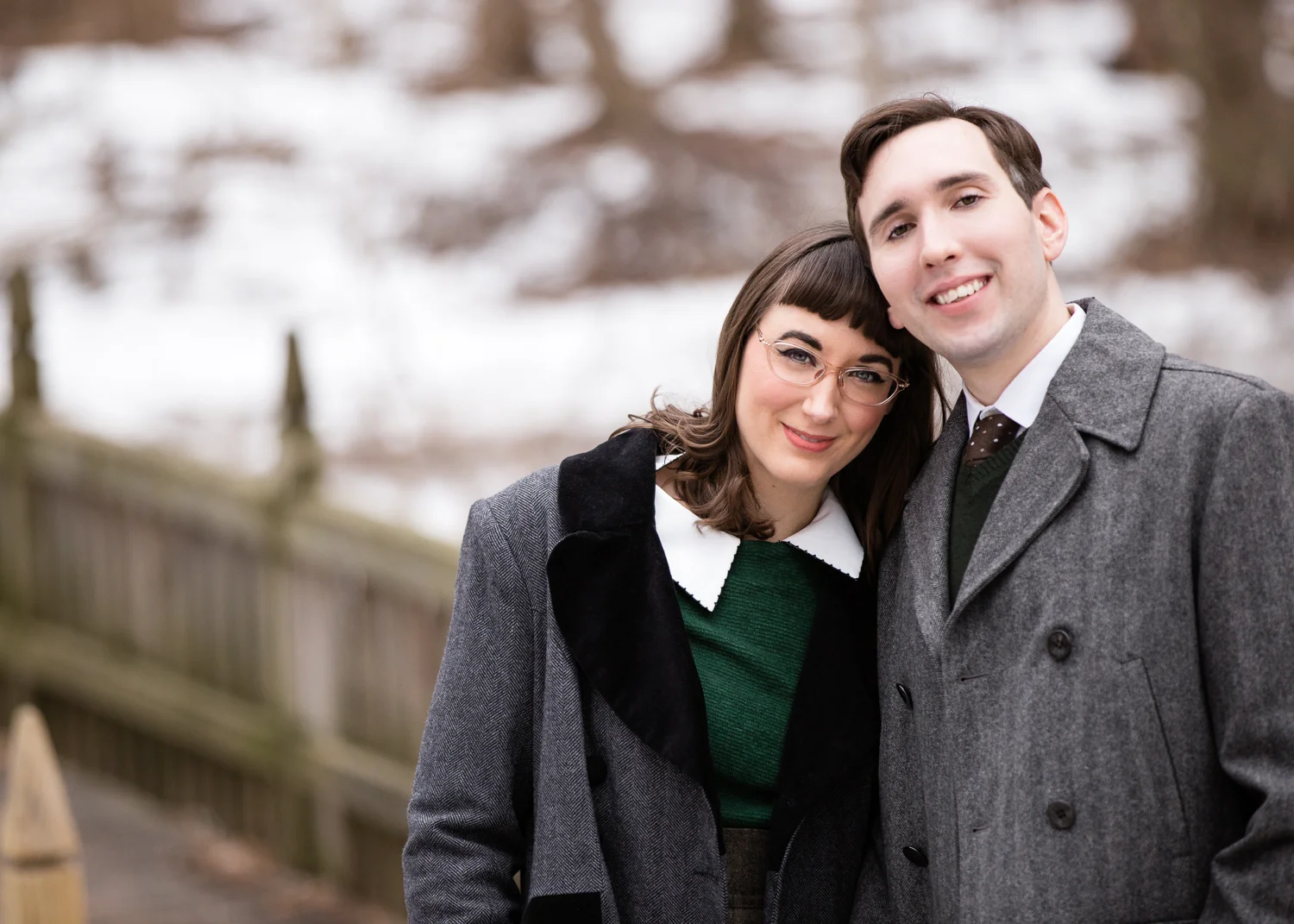 Photo of a vintage / retro looking young couple in the snow