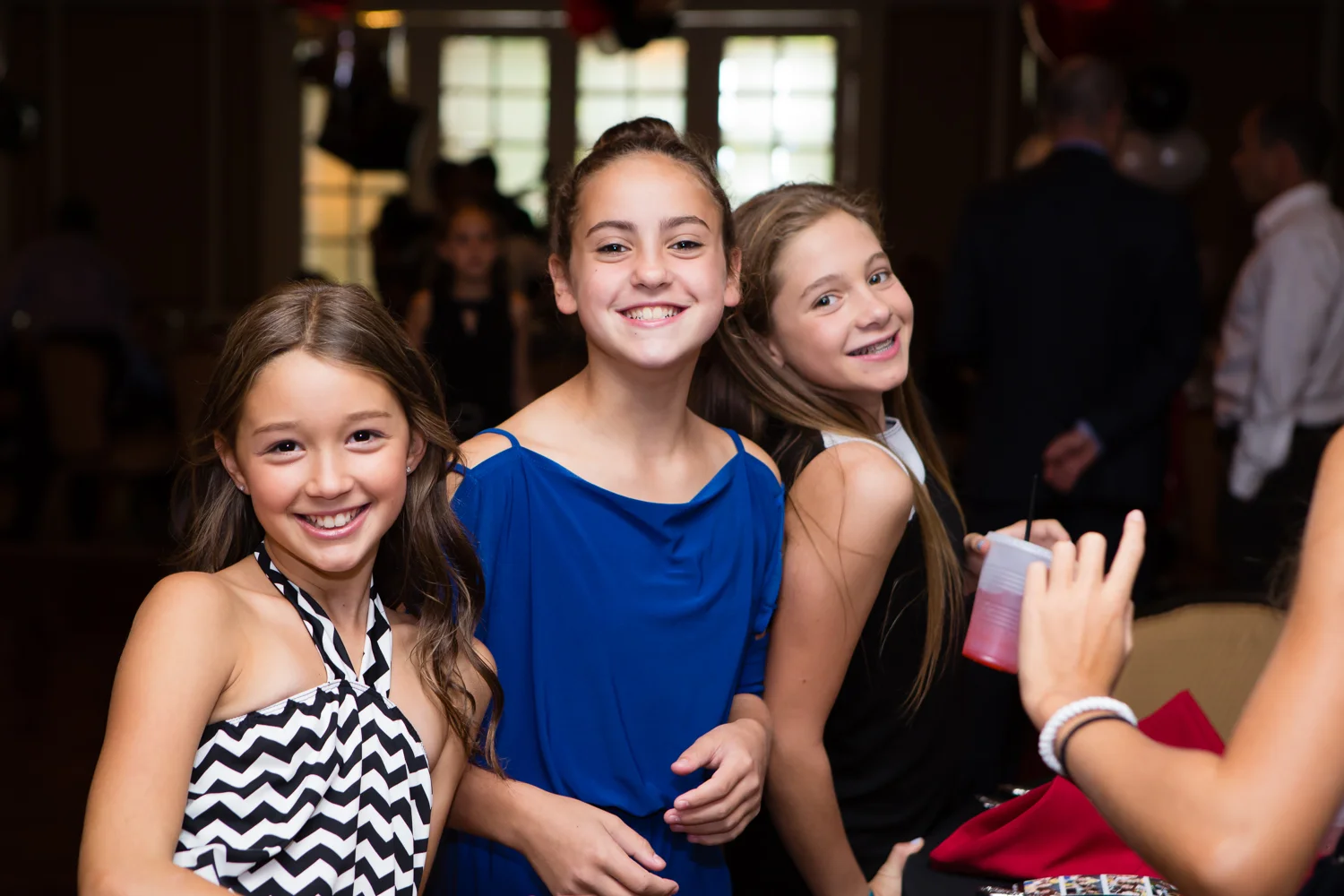 Photo of smiling girls at Bat Mitzvah ceremony