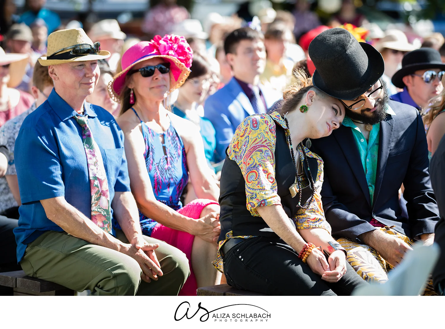 Photograph of outdoor wedding guests during ceremony