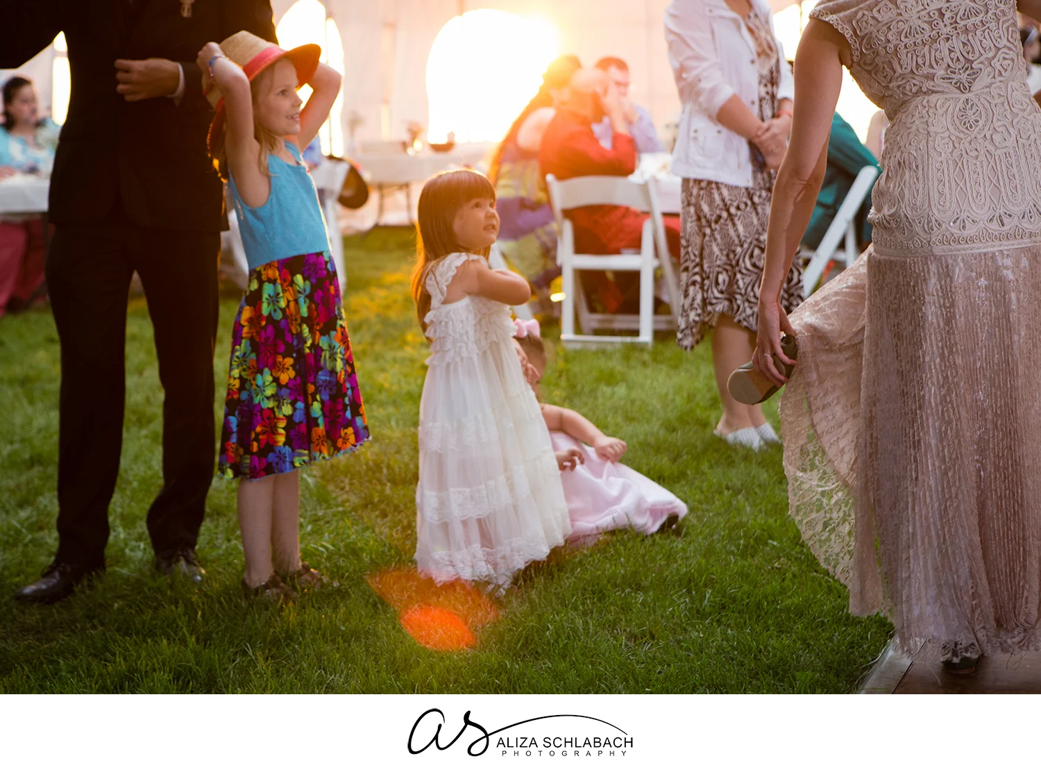 Backlit photo of little girls at a wedding reception