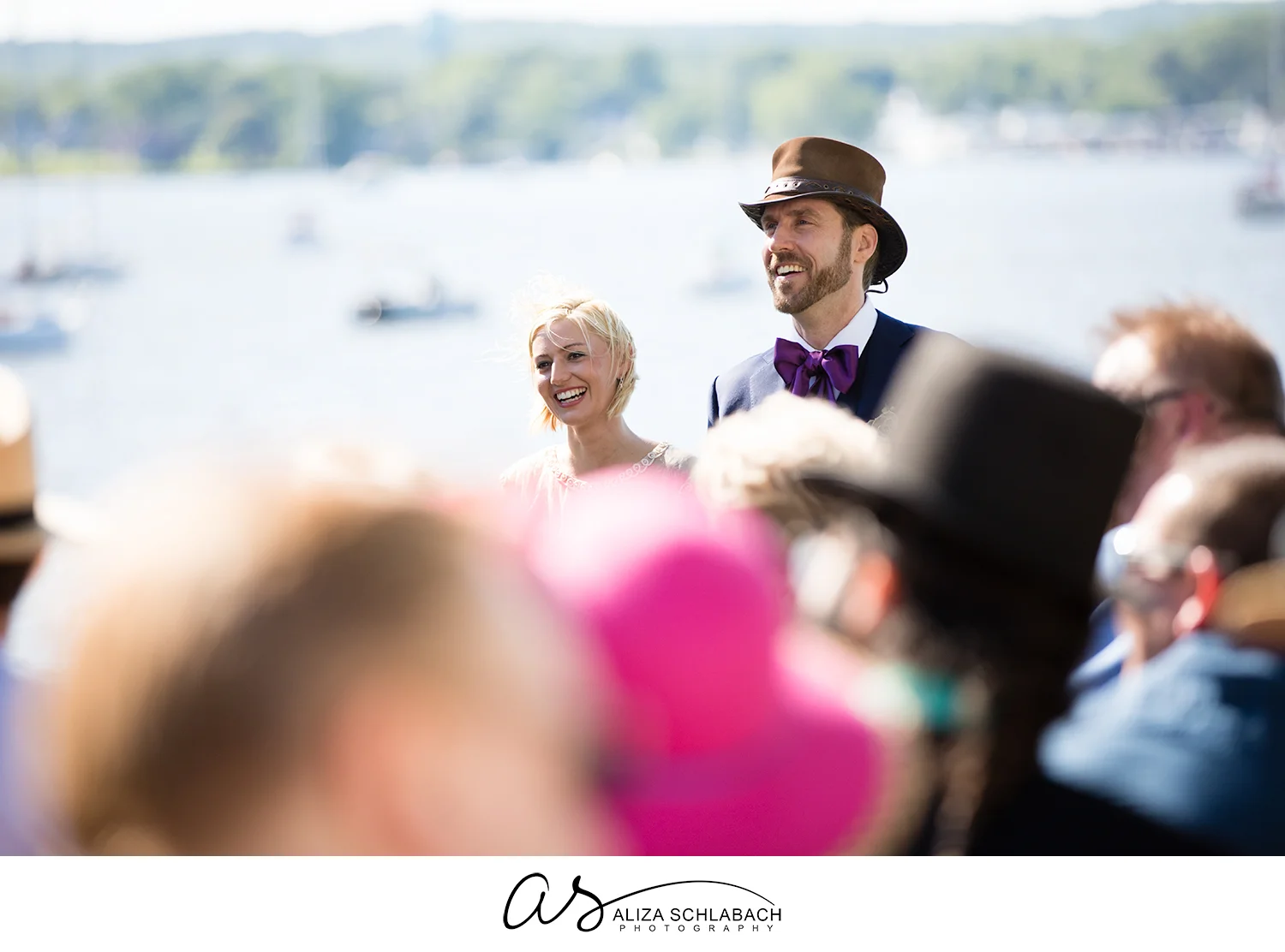 Photo of bride and groom during their wedding over the crowd