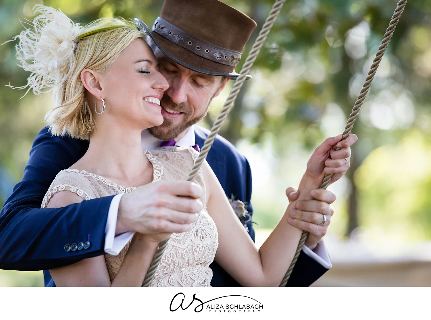 Photo of bride and groom on an outdoor wooden swing