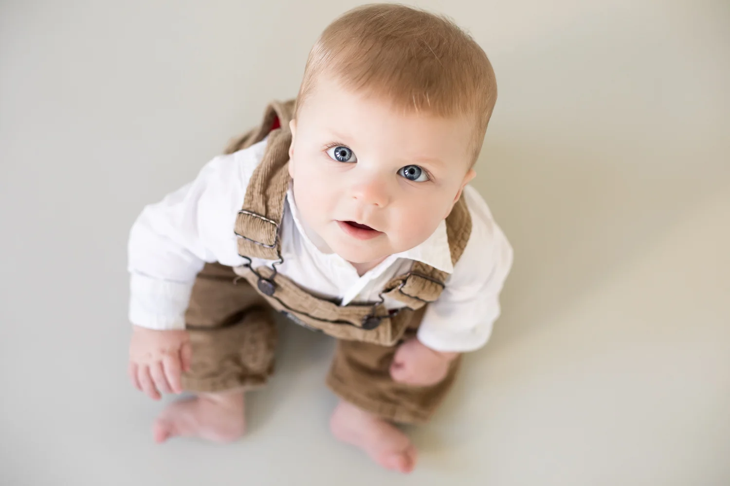 Baby boy portrait, looking up into camera