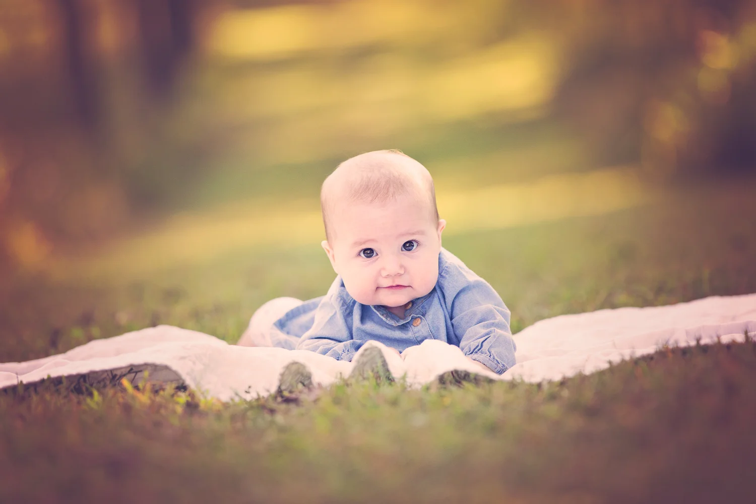 Back on a blanket during tummy time outdoors