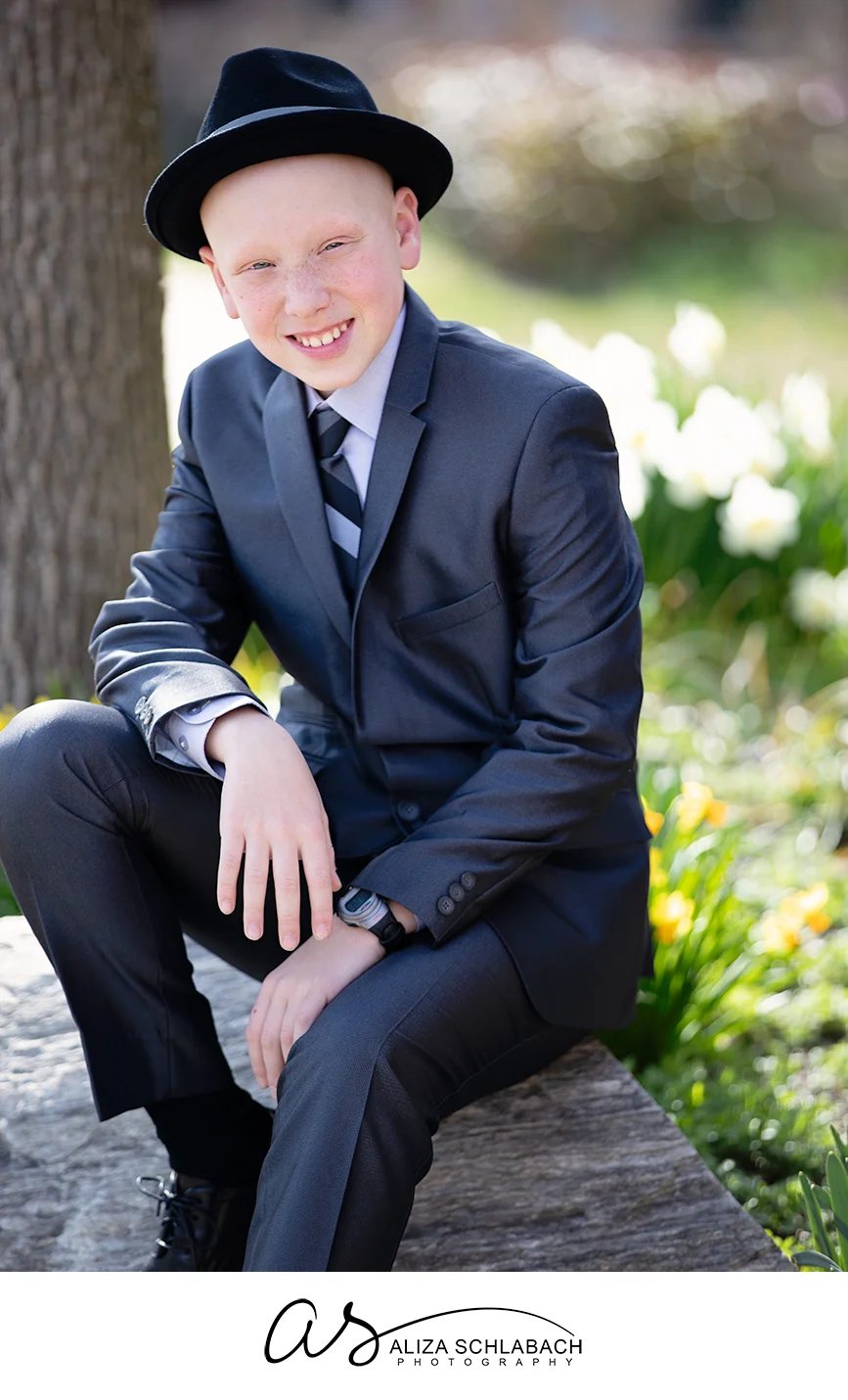 Outdoor portrait of Bar Mitzvah boy with hat