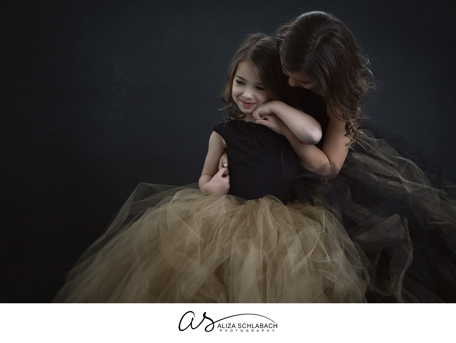 Portrait of sisters embracing