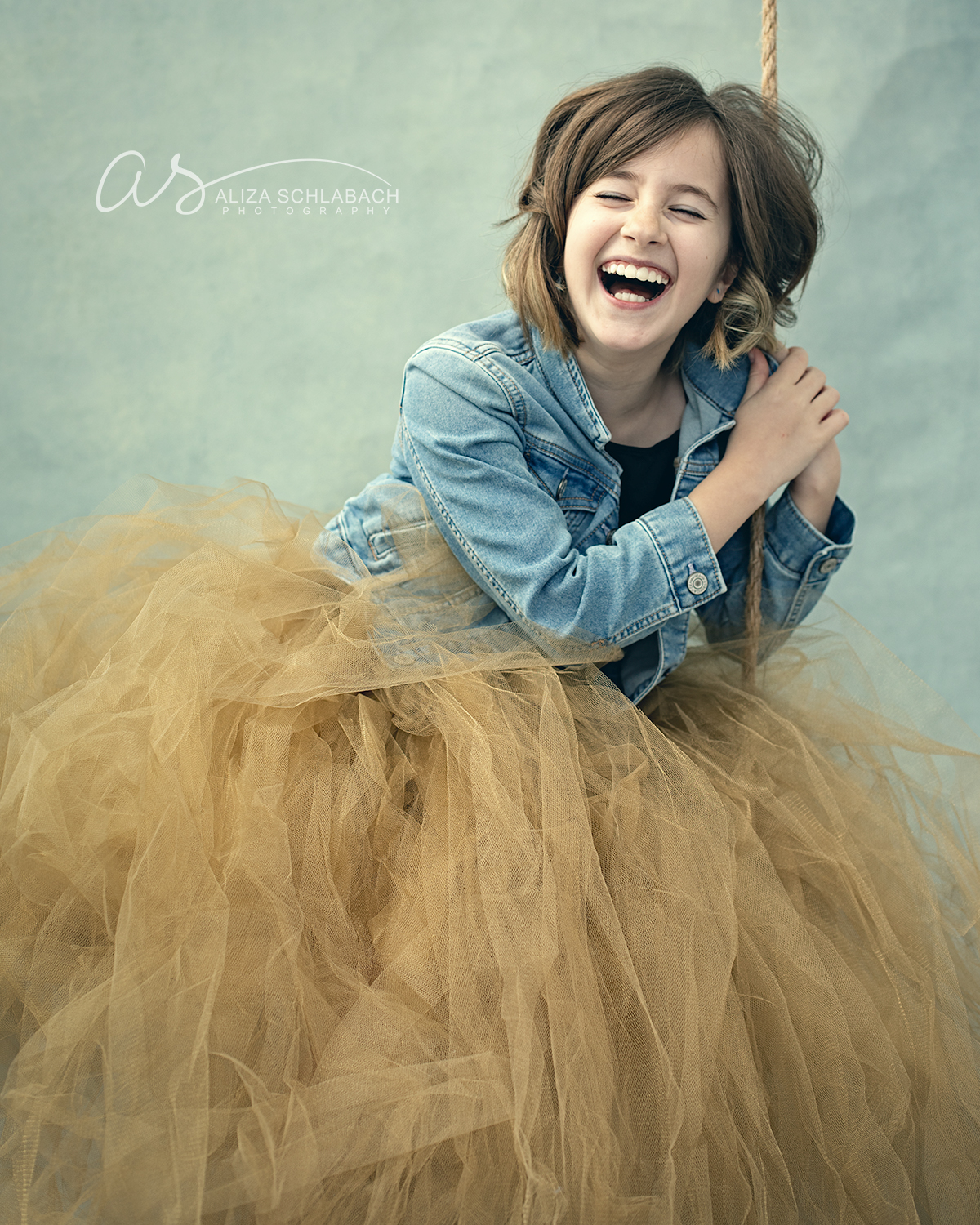 girl in tulle skirt laughing hysterically