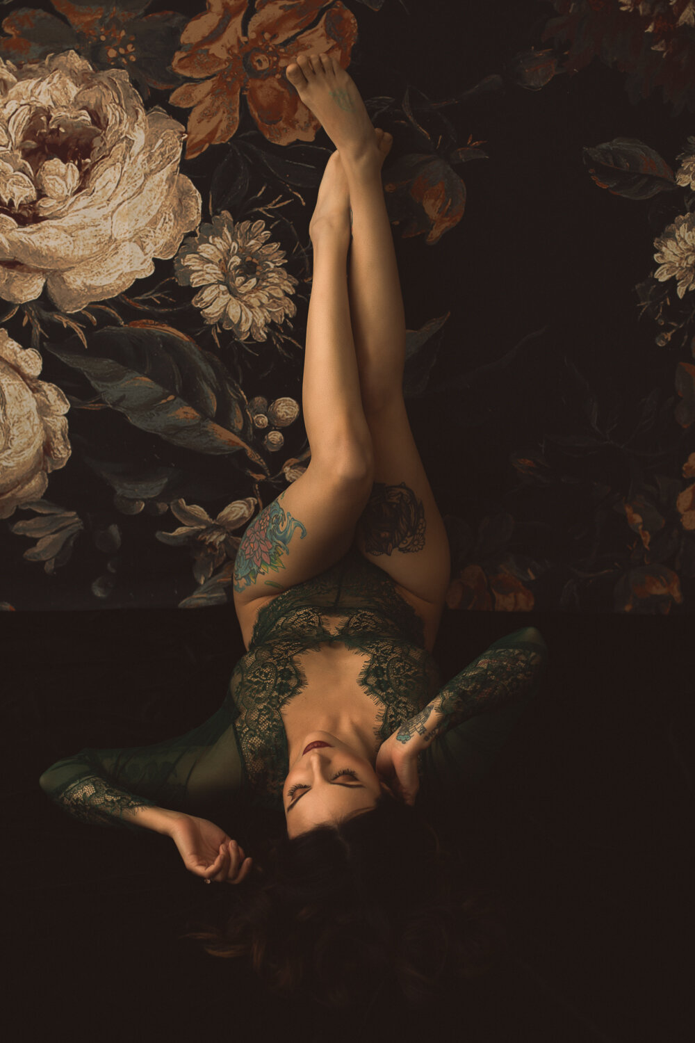 Boudoir photo of a woman with legs for days - and great ink!