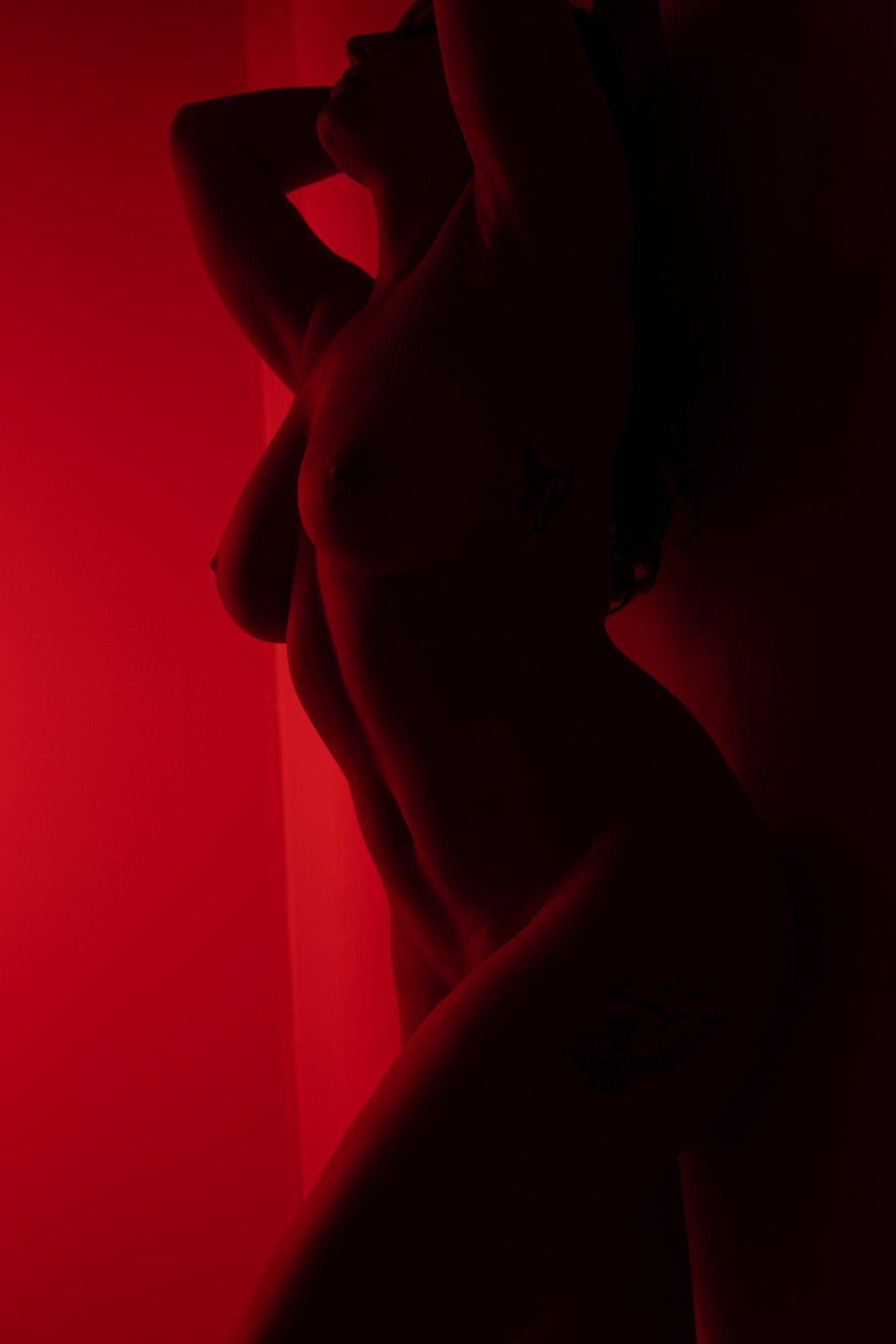 Red room boudoir photograph in Philly Pennsylvania